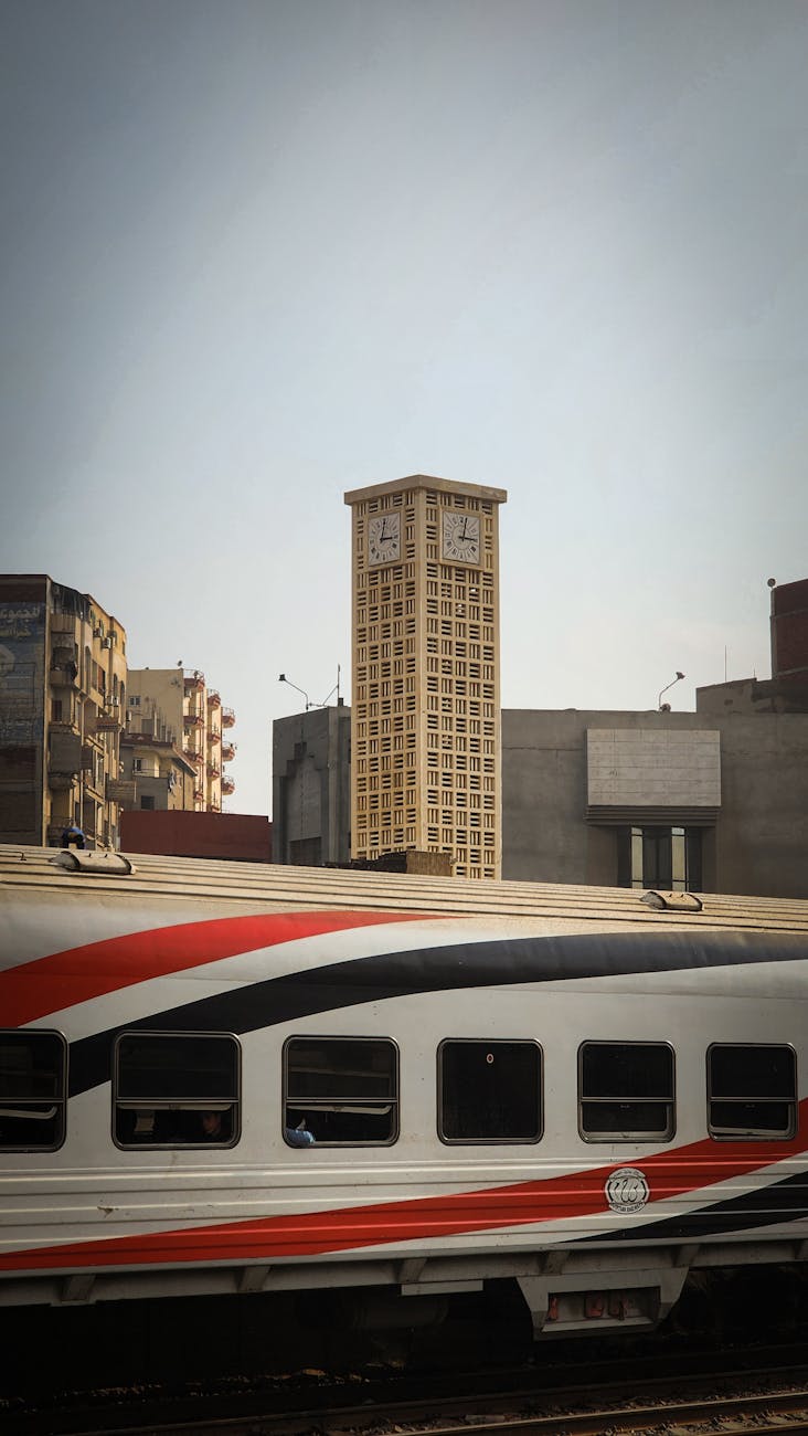 Train passing by the historic clock tower in Zagazig, Egypt.