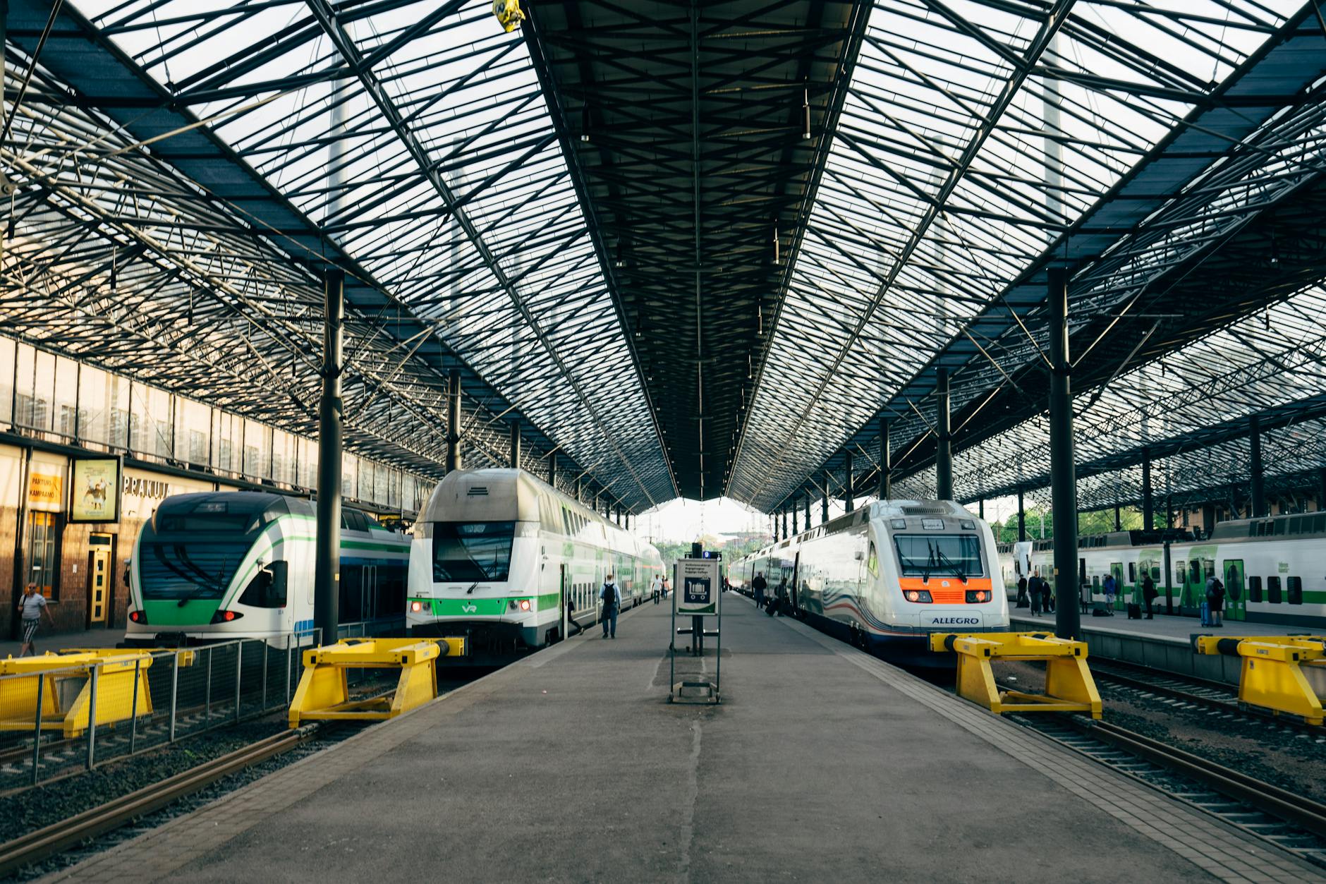Platform scene at Helsinki Central Station with multiple trains.