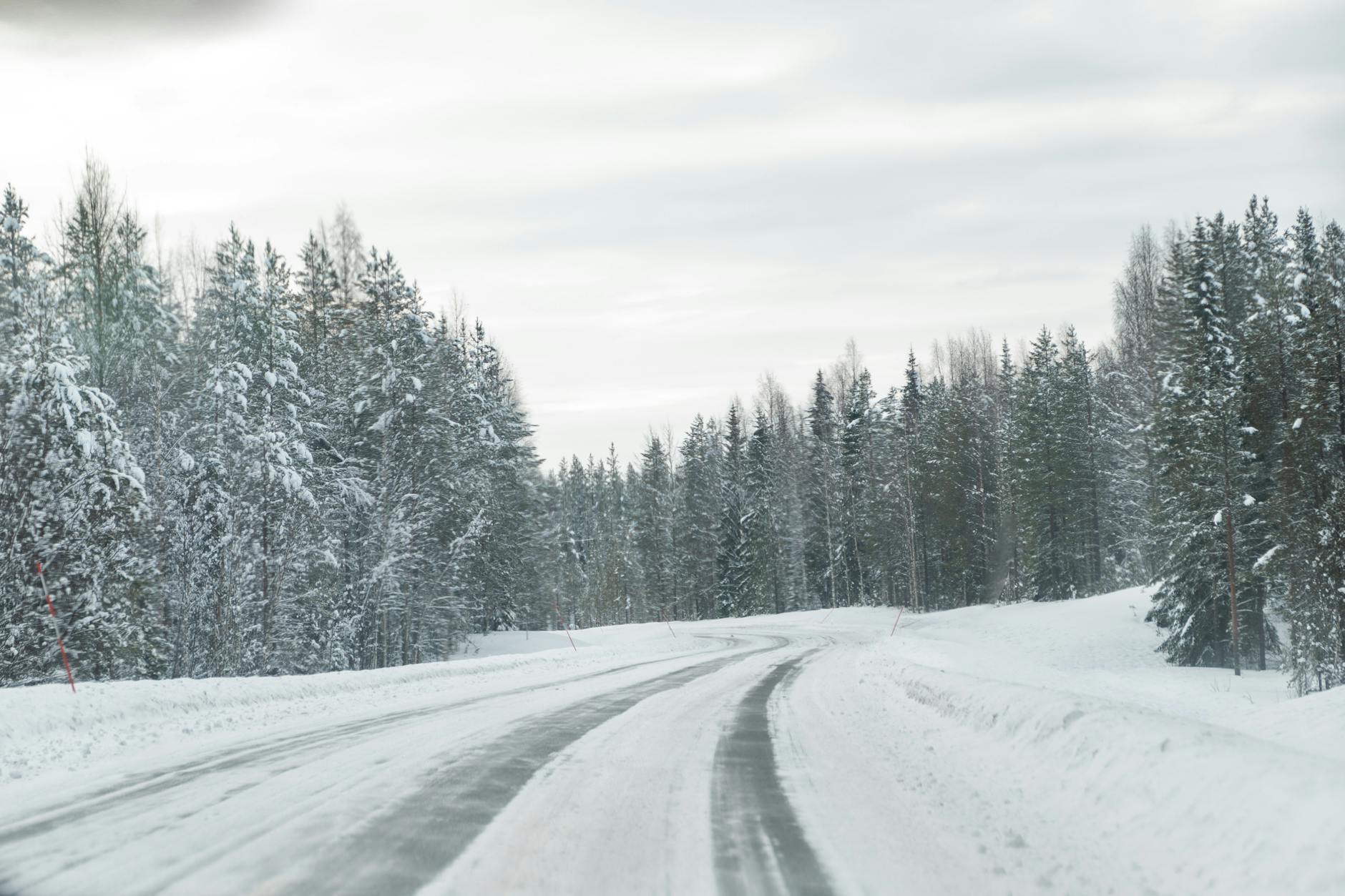 Snowy winter road in Rovaniemi, Lapland.