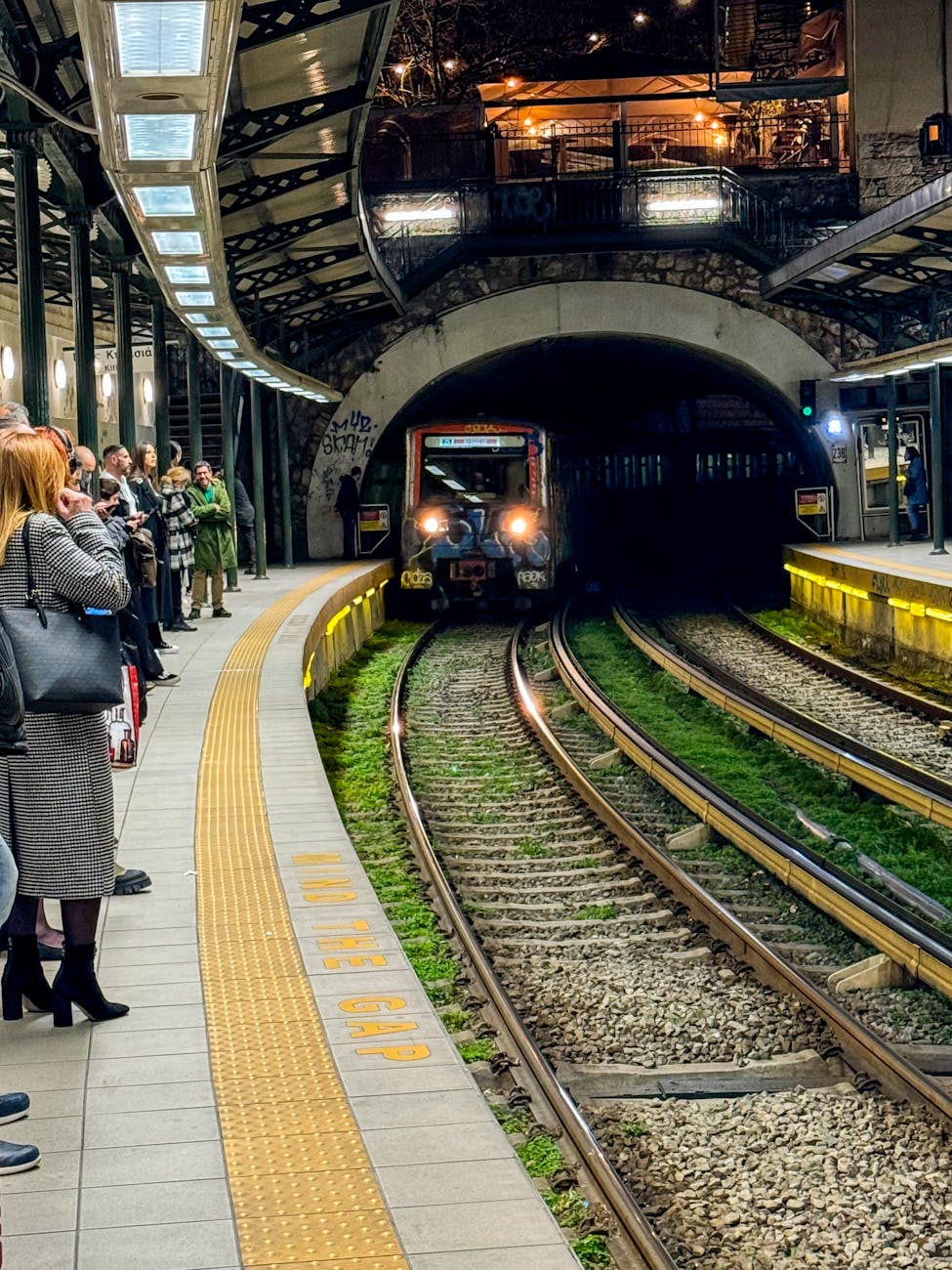 Passengers waiting for an Athens metro train.