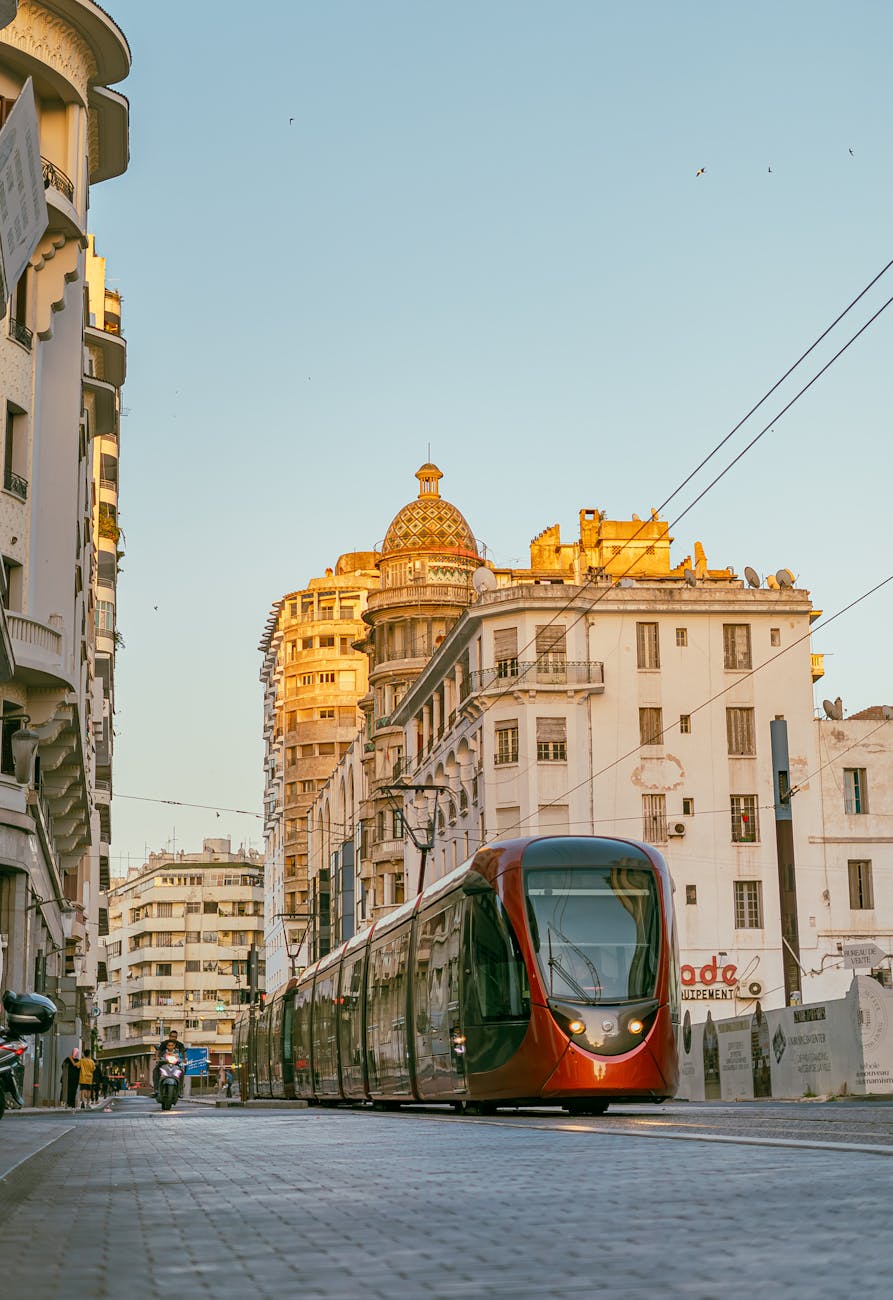 Casablanca tram moving past historic architecture.