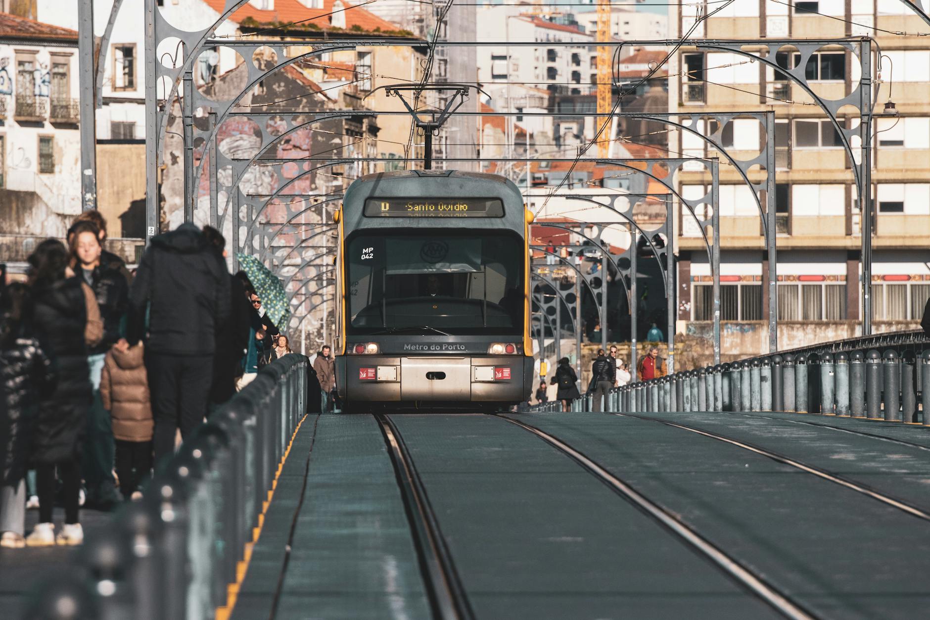Metro train crossing the Ponte Luis I bridge in Porto.