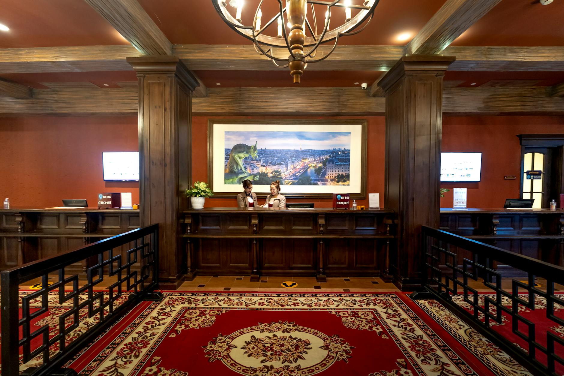 Elegant and luxurious hotel reception with classic wooden design and plush carpeting.