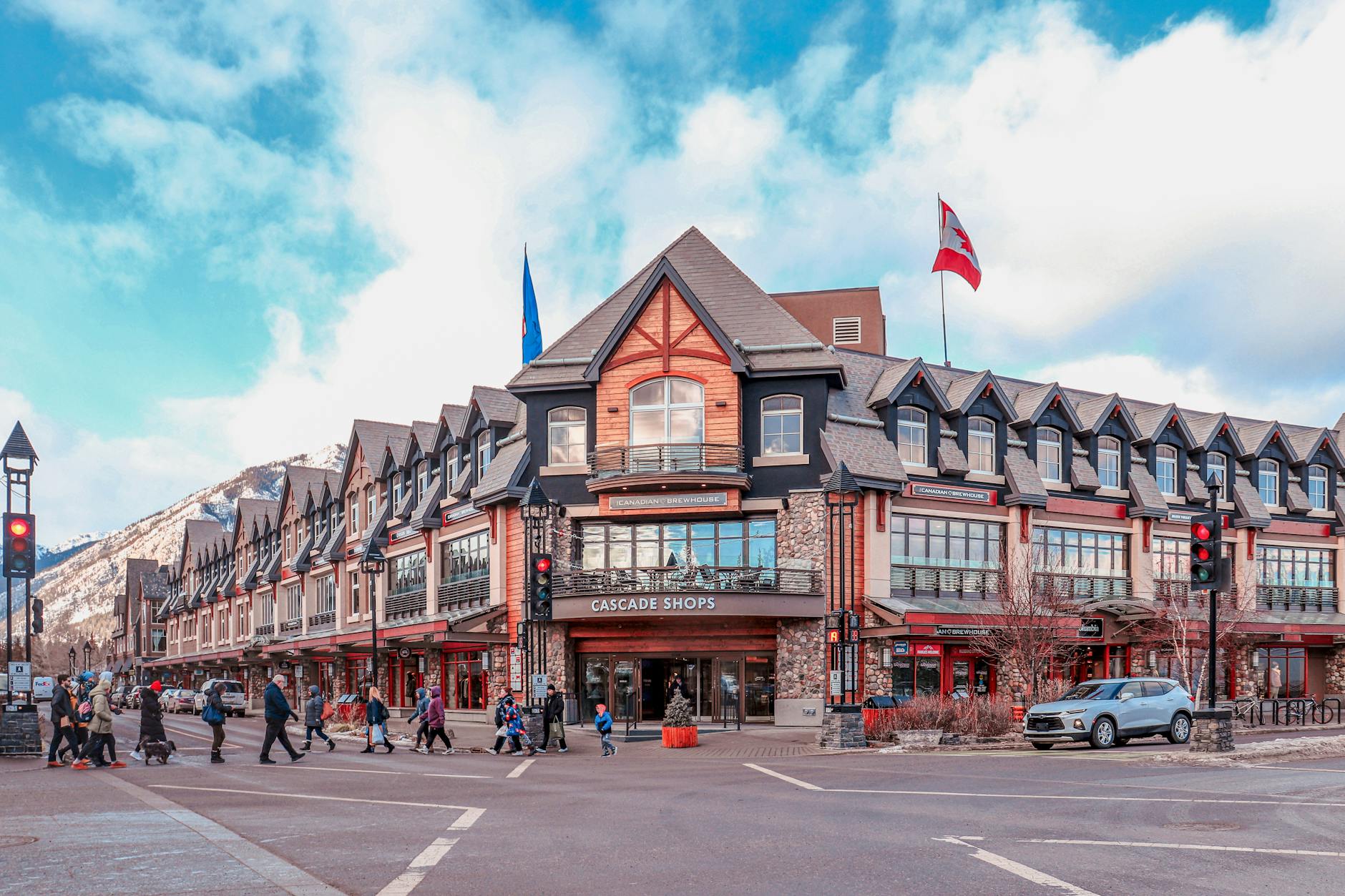 Picturesque Cascade Shops in Banff, Alberta with a bustling winter scene.