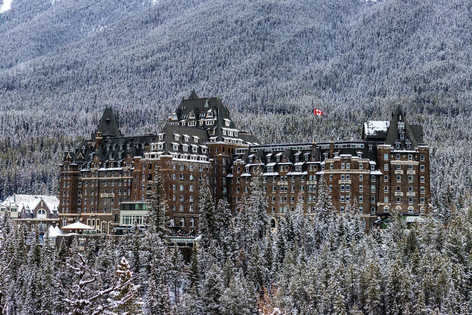 Snowy landscape with the majestic Banff Springs Hotel in winter.
