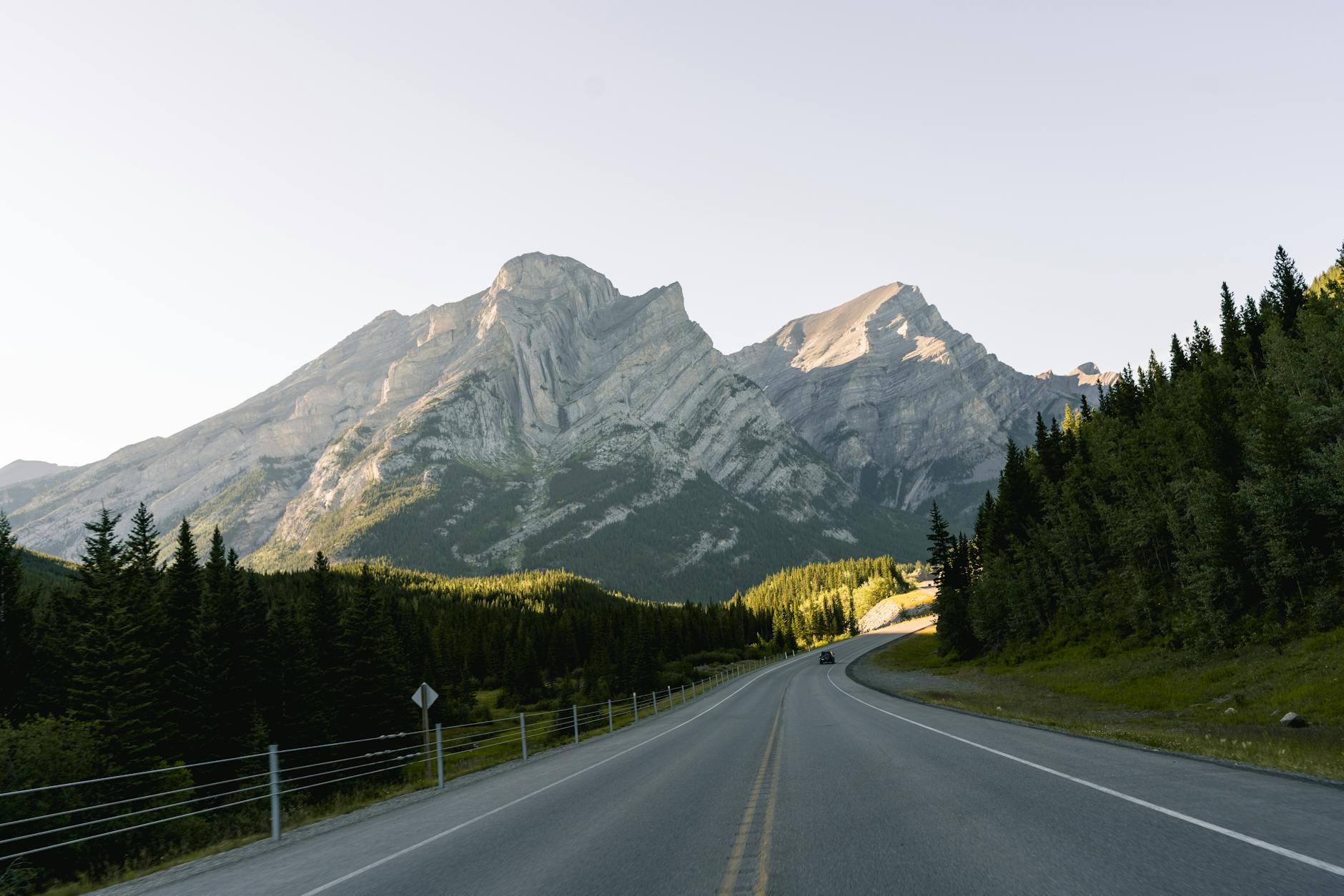A picturesque view of rocky mountains and road in Banff National Park, Alberta, Canada.