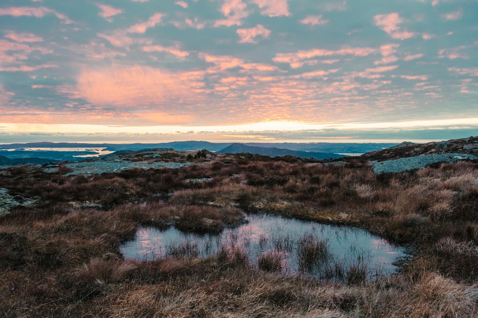 Norwegian mountain valley at sunset for route planning.