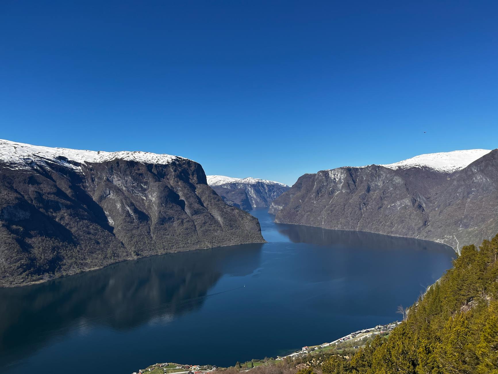 Norwegian fjord and snow-capped mountains for outdoor weather planning.