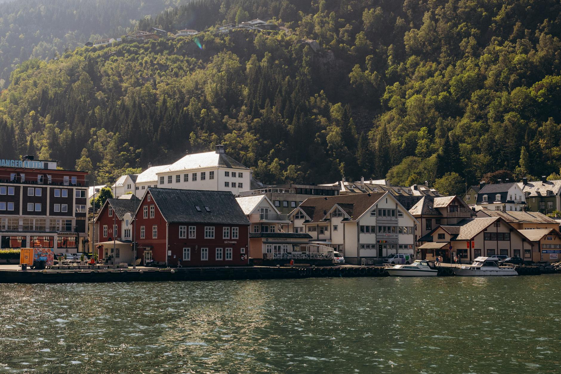 Bergen waterfront framed by hills for family hotel base planning.