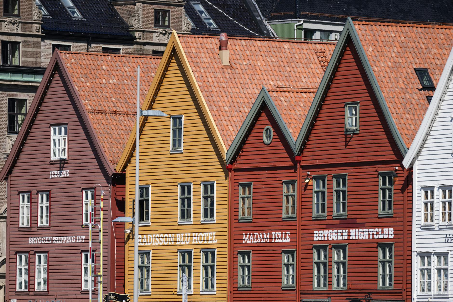 Colorful Bryggen buildings for family visitor route planning.