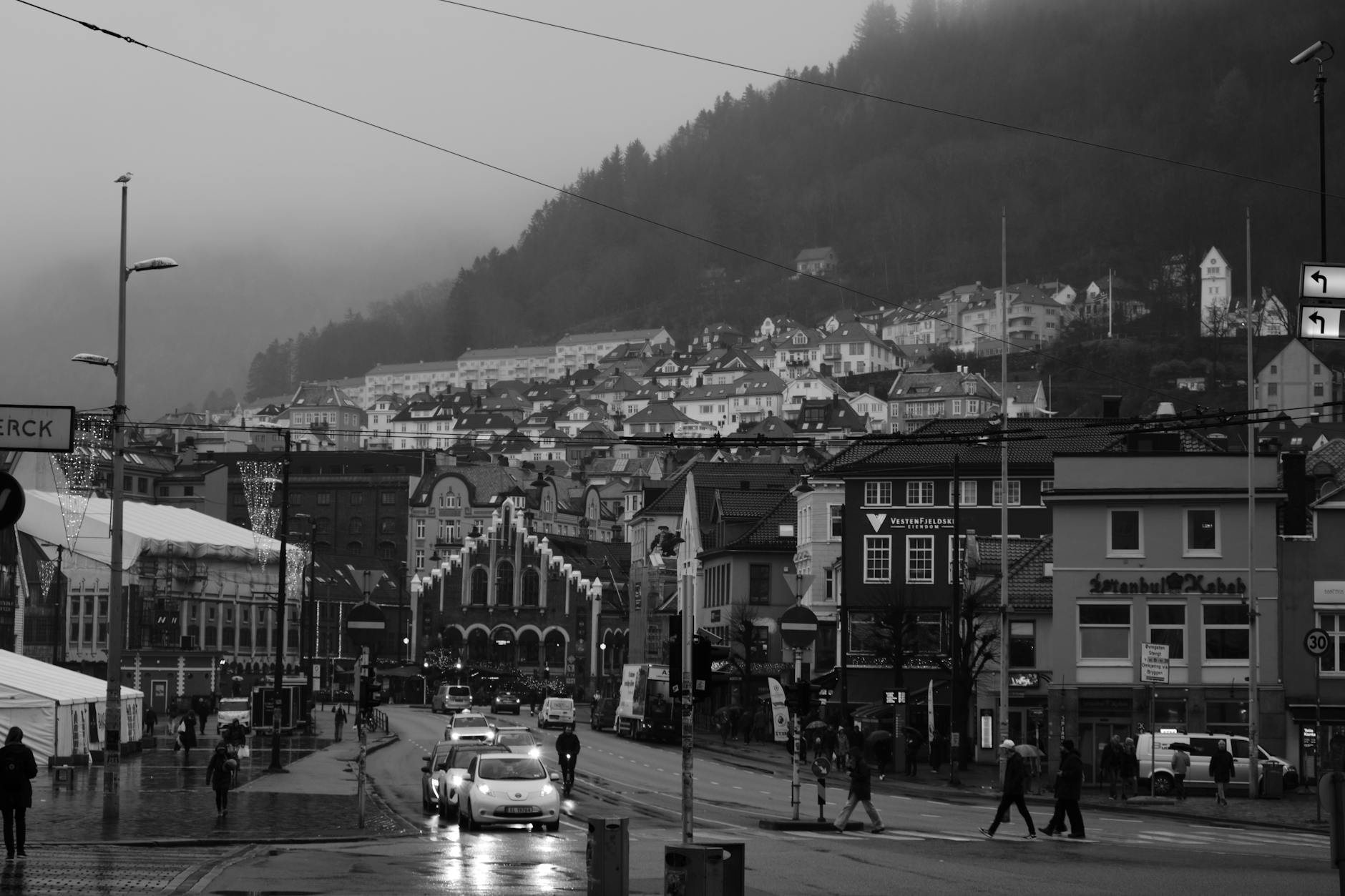 Rainy Bergen street for first-time visitor weather planning.