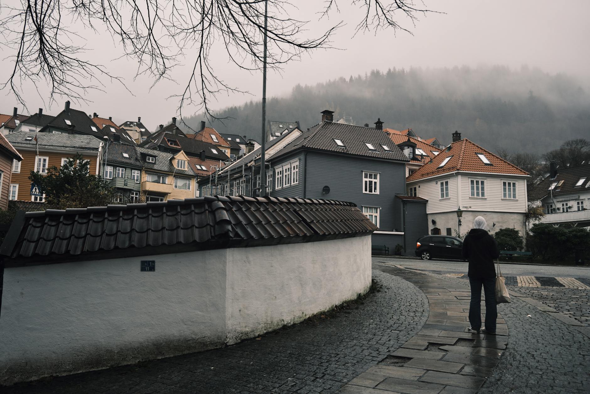 Misty Bergen street for luxury rain and transition planning.