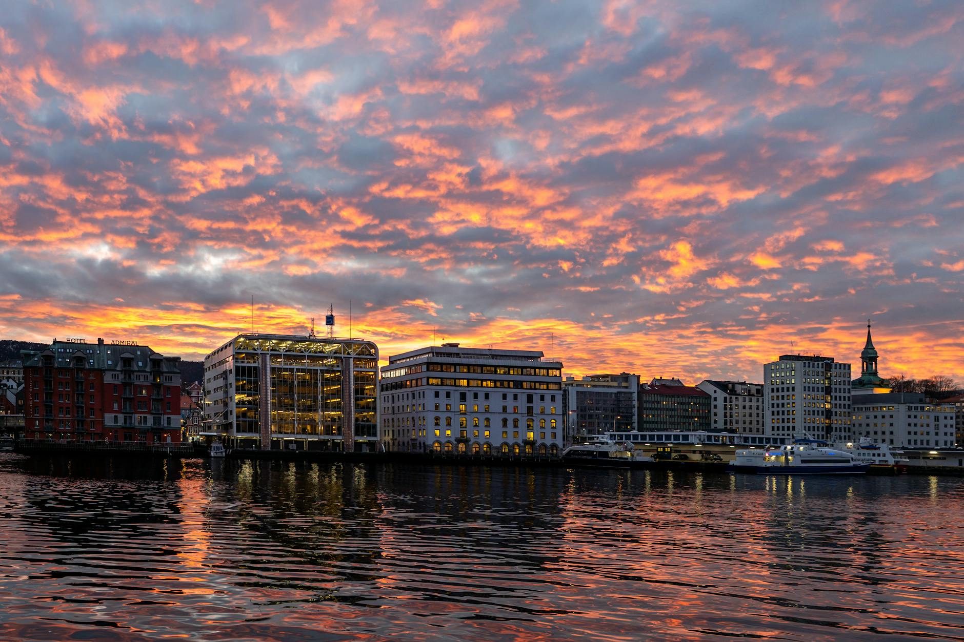 Sunset over Bergen waterfront for luxury evening planning.