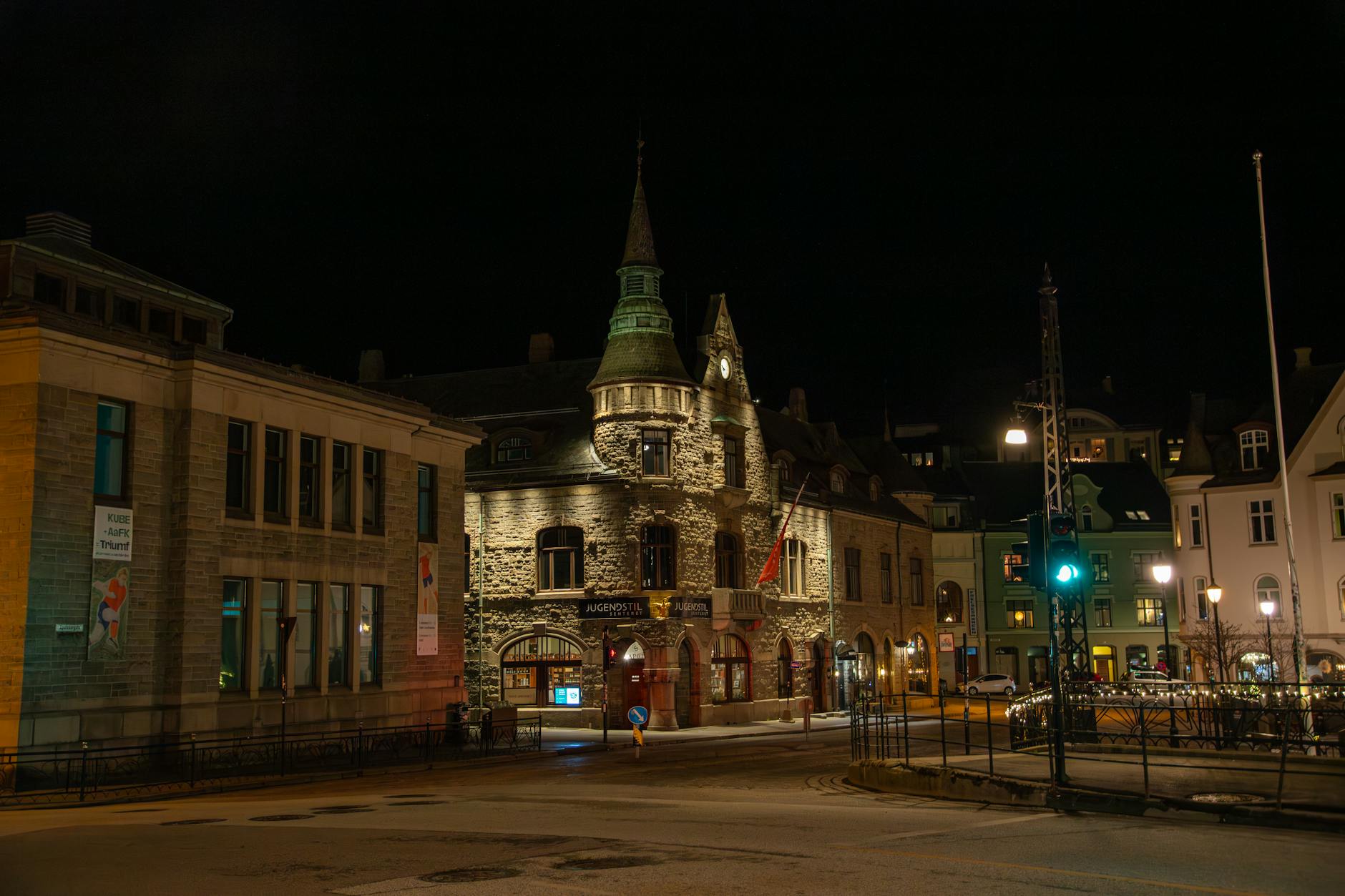 Illuminated Norwegian street at night for nightlife budget planning.