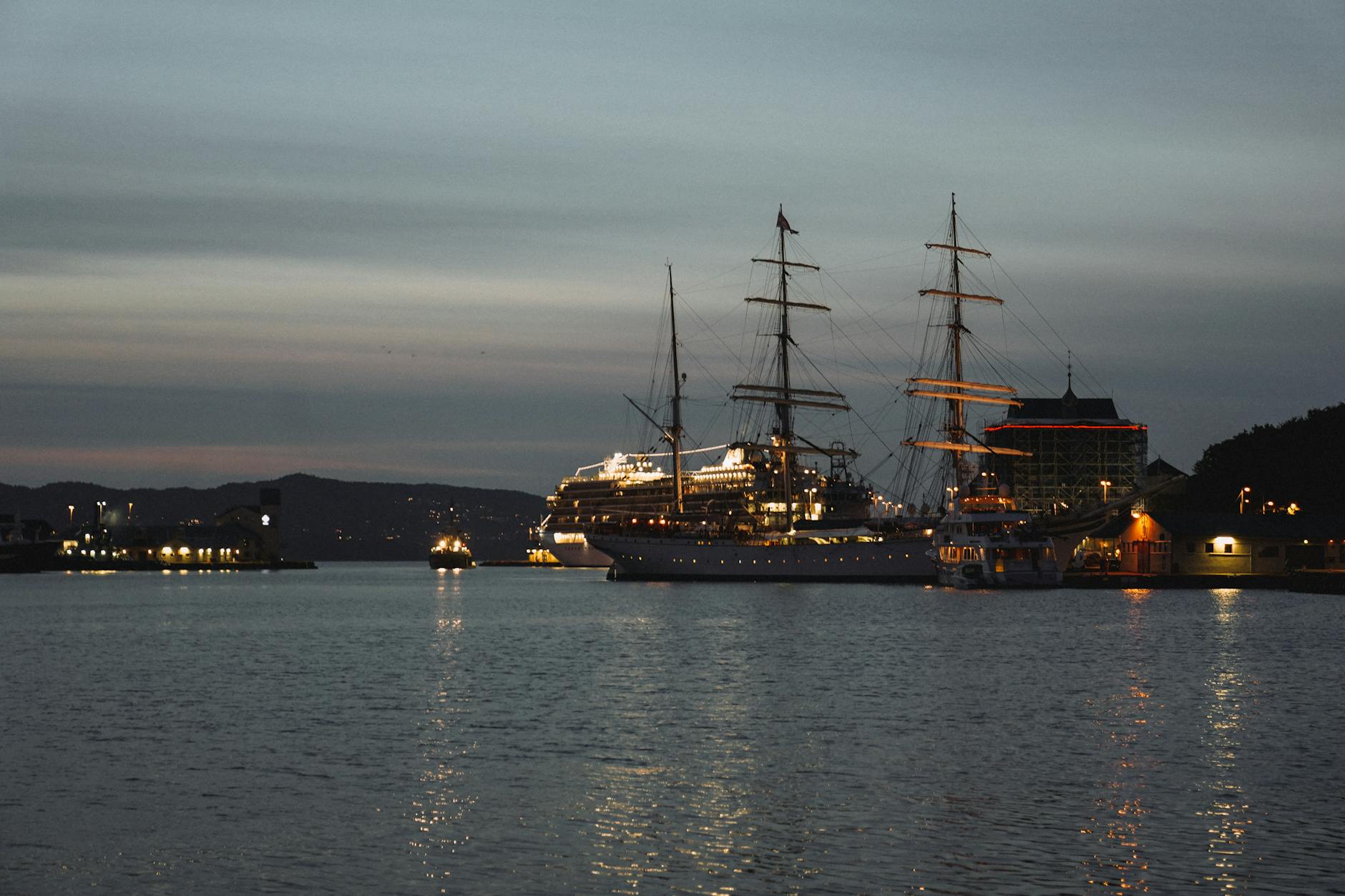 Norwegian harbor at twilight for nightlife return-route planning.
