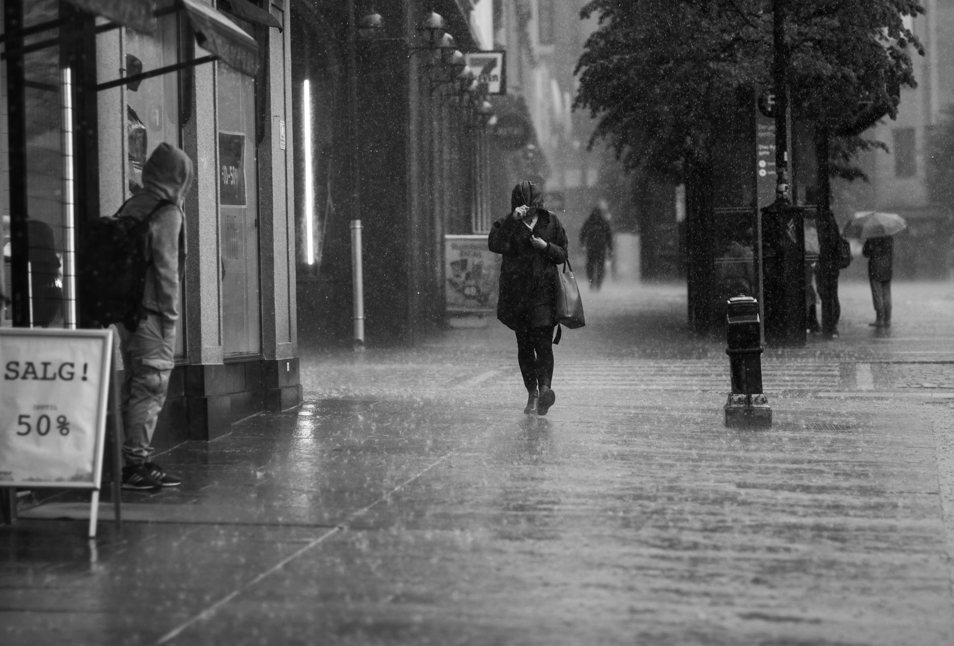 Rainy Bergen street for older traveler footing planning.