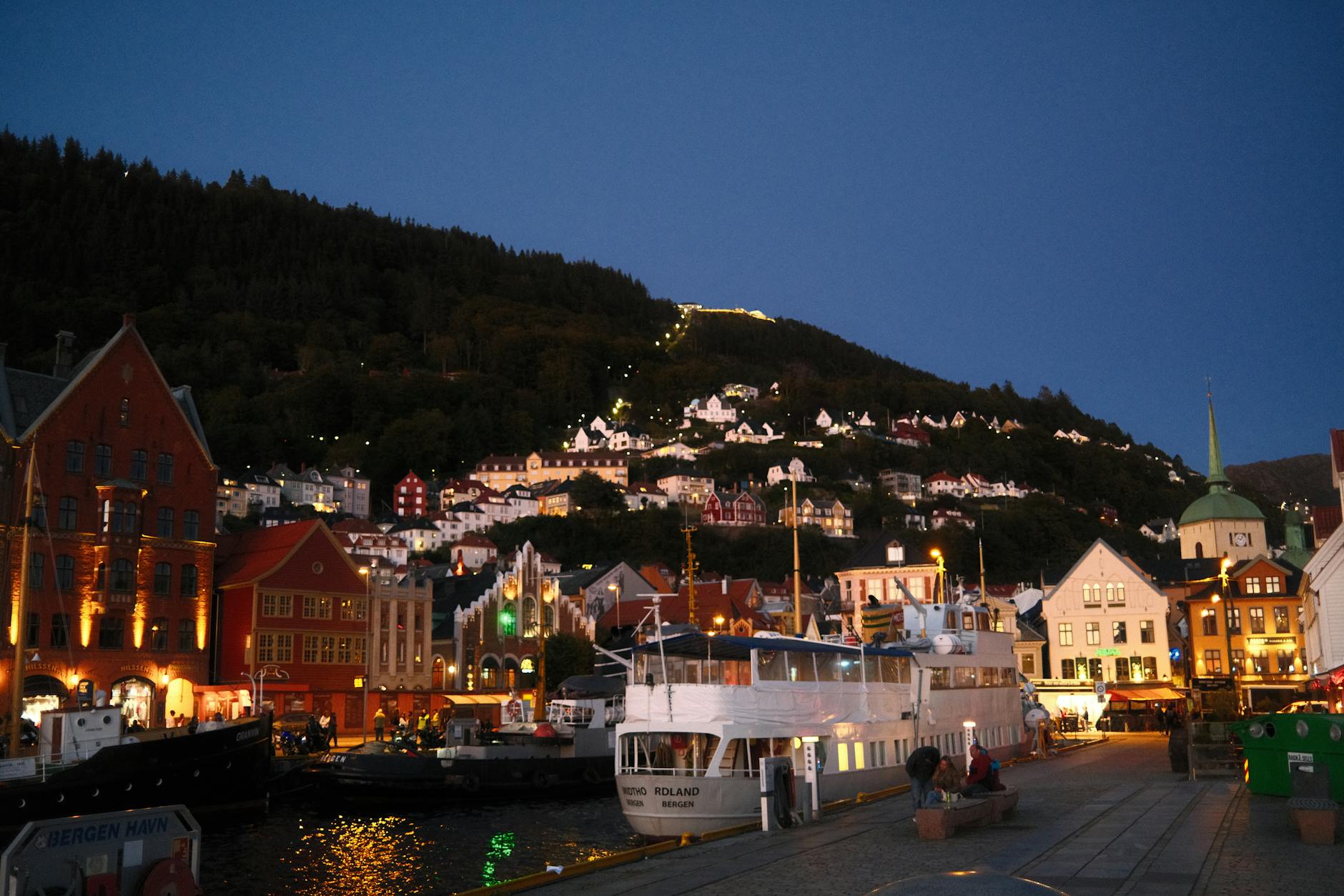 Bergen evening harbor for older traveler return planning.