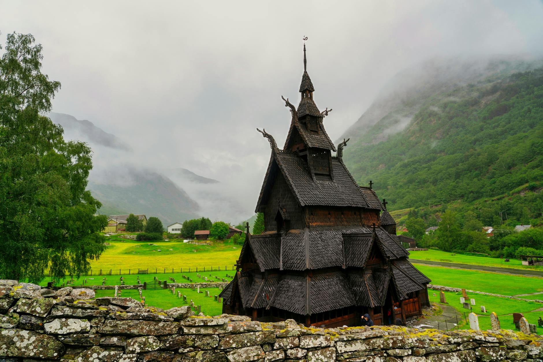 Stave church in Norwegian mountains for religious travel report planning.