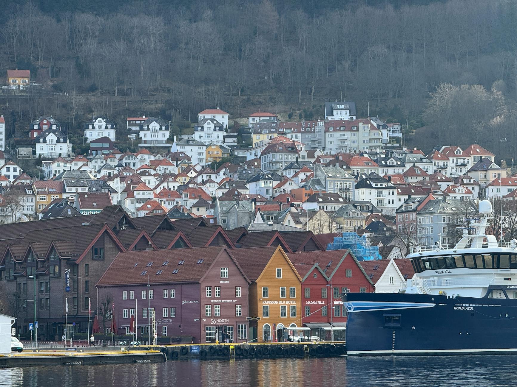 Ship docked by Bryggen for repeat Bergen route planning.