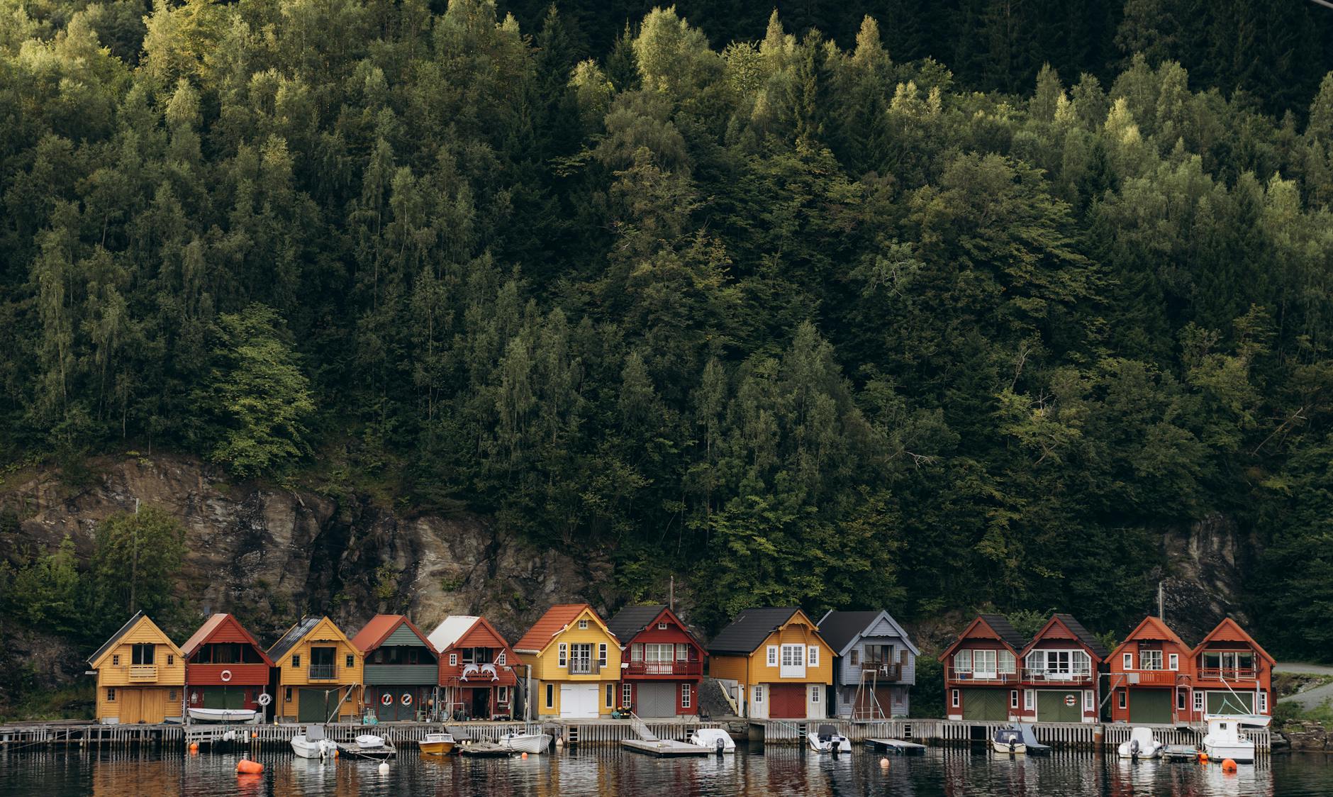 Colorful Bergen boathouses for sales prospect geography planning.