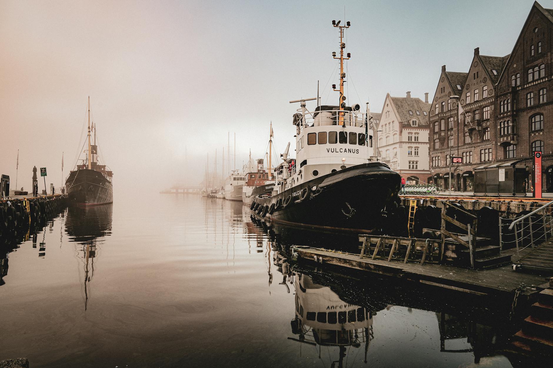 Foggy Bergen harbor for solo rain and visibility planning.