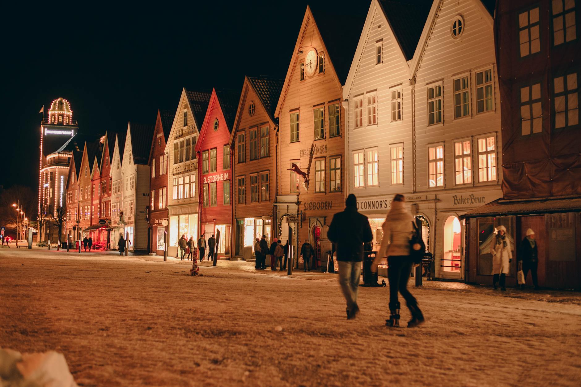 Nighttime Bryggen buildings for Bergen tourist evening planning.