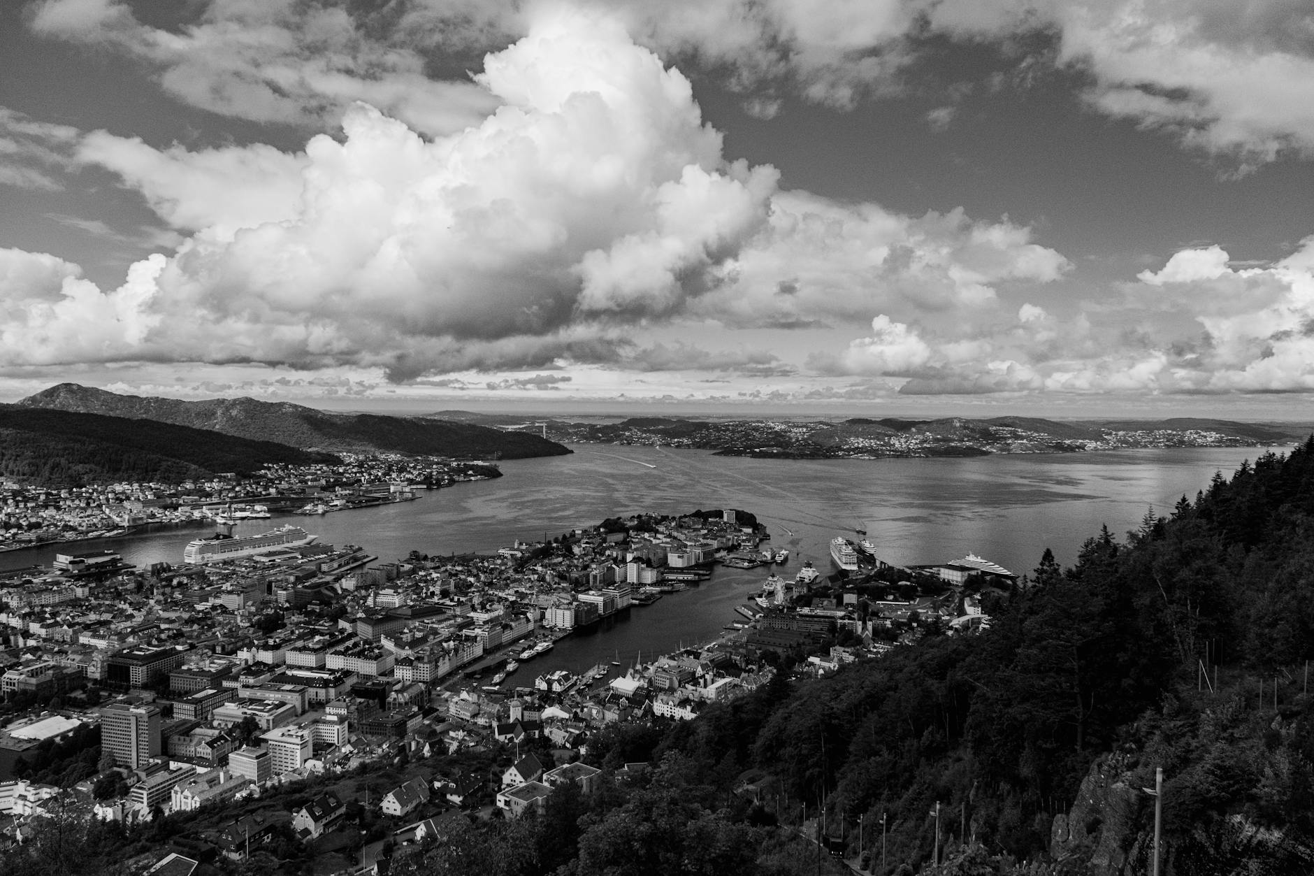 Dramatic aerial Bergen cityscape for trade-show rain planning.