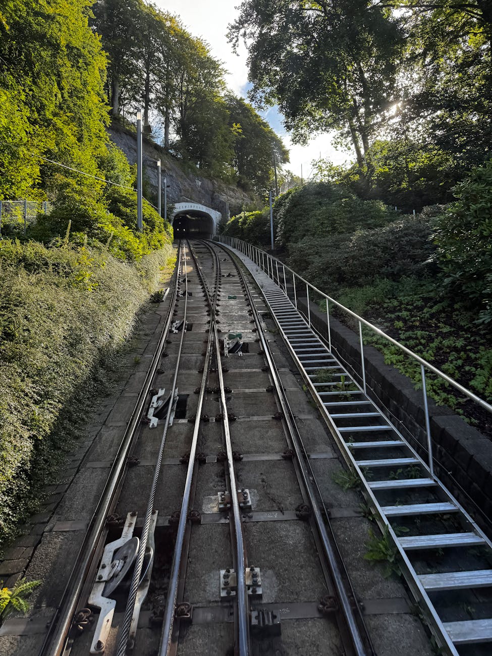 Bergen rail tracks entering a tunnel for connection planning.