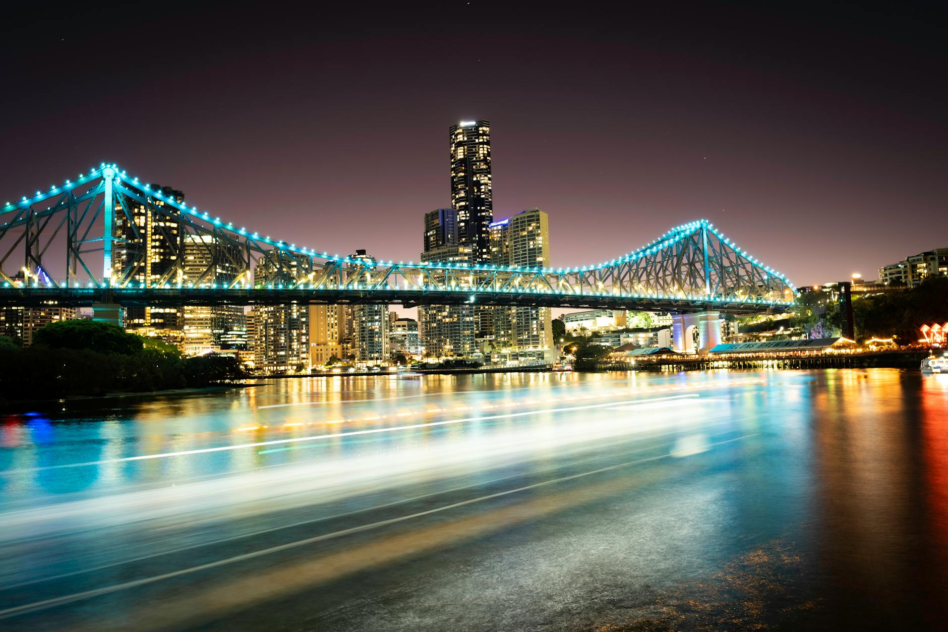Brisbane Story Bridge at night for academic networking logistics.