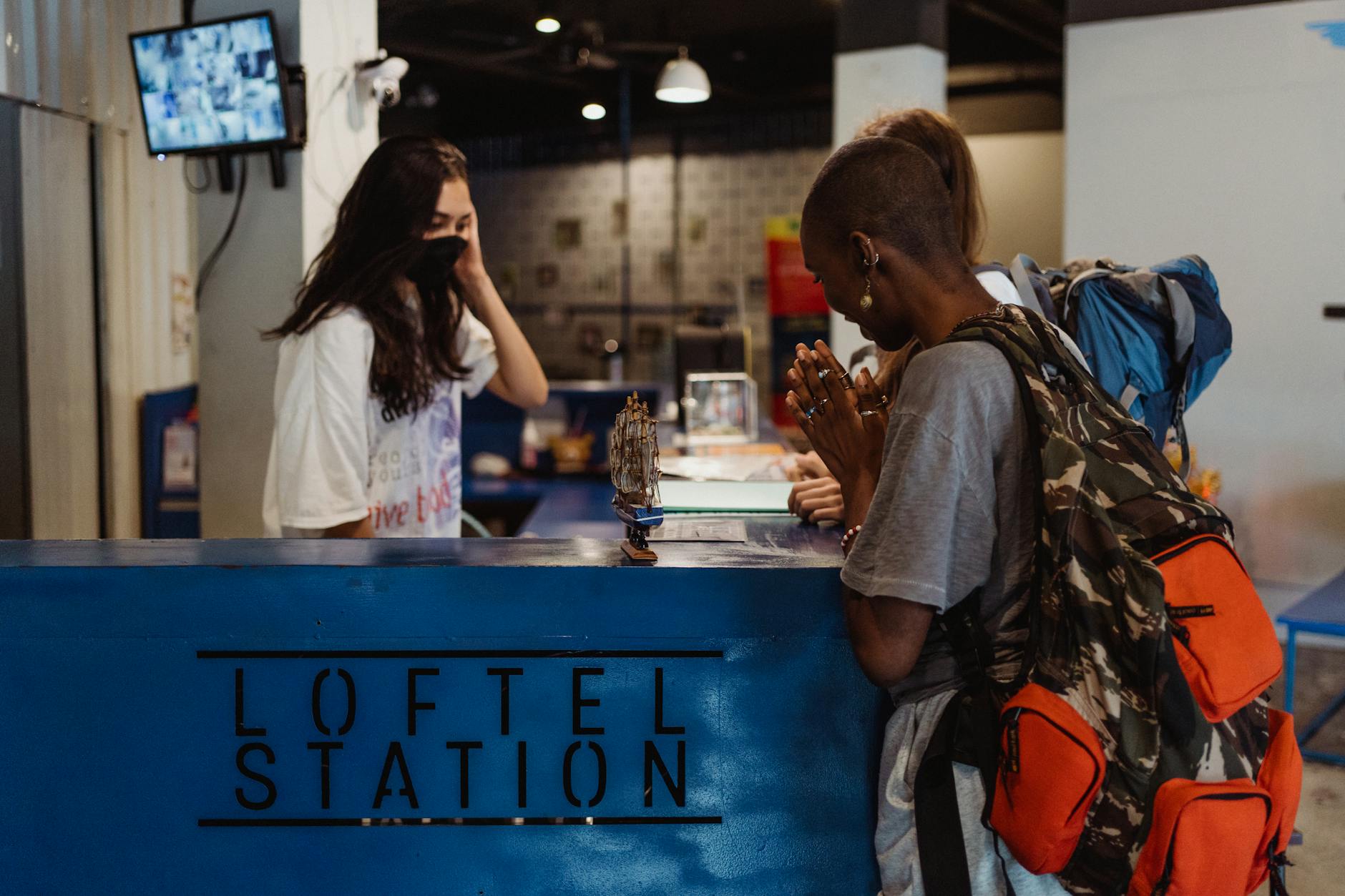 Hostel reception for budget lodging and meal-base planning.