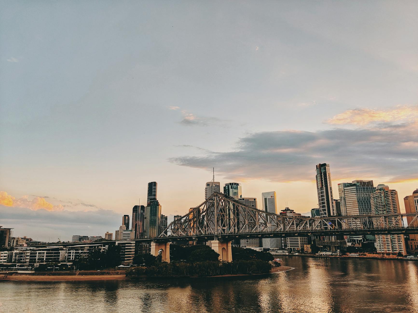 Brisbane skyline and Story Bridge at twilight for business travel report planning.