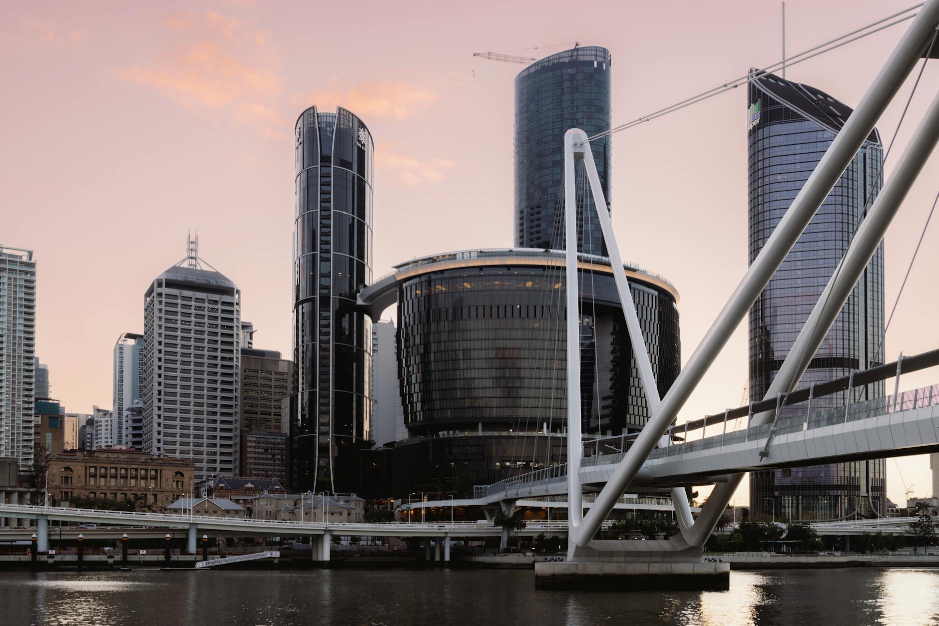 Brisbane skyline at dusk for conference venue geography planning.
