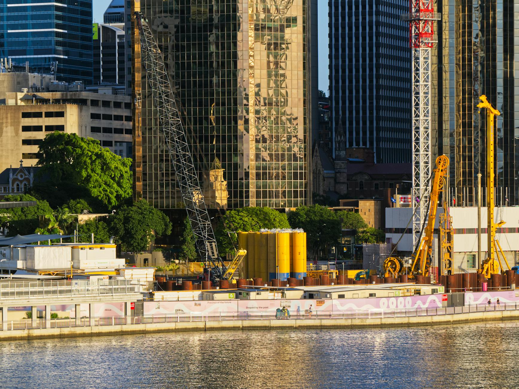 Brisbane urban skyline and river construction for conference attendee planning.