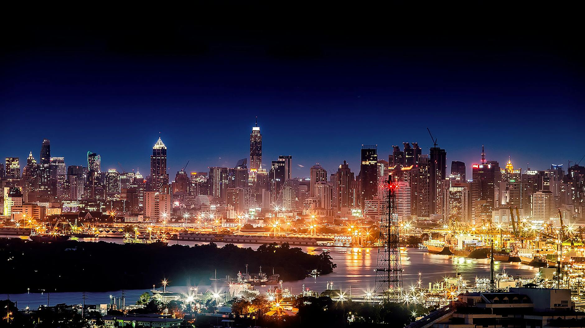 Night city skyline for Brisbane conference travel report planning.
