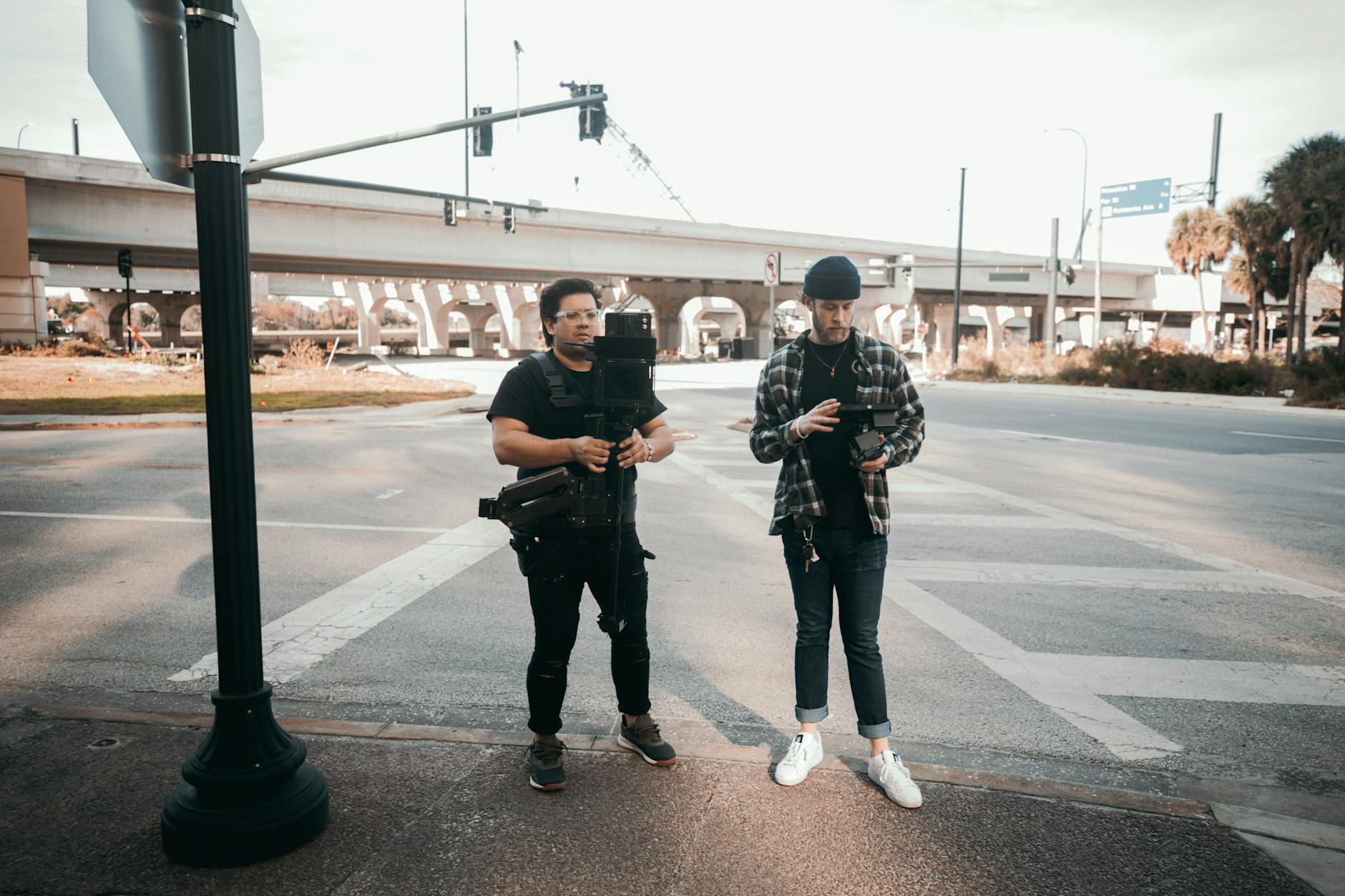 Filmmakers on an urban street for Brisbane content creator report planning.
