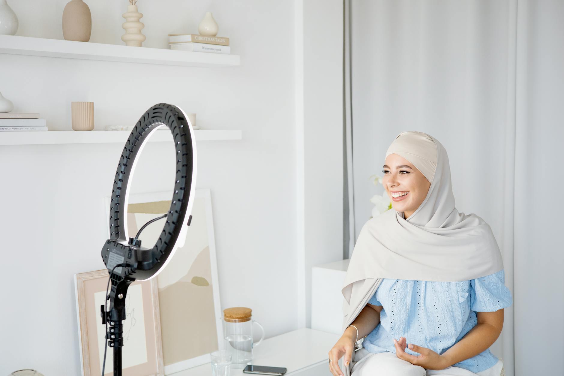 Creator filming with a ring light for Brisbane responsible posting planning.
