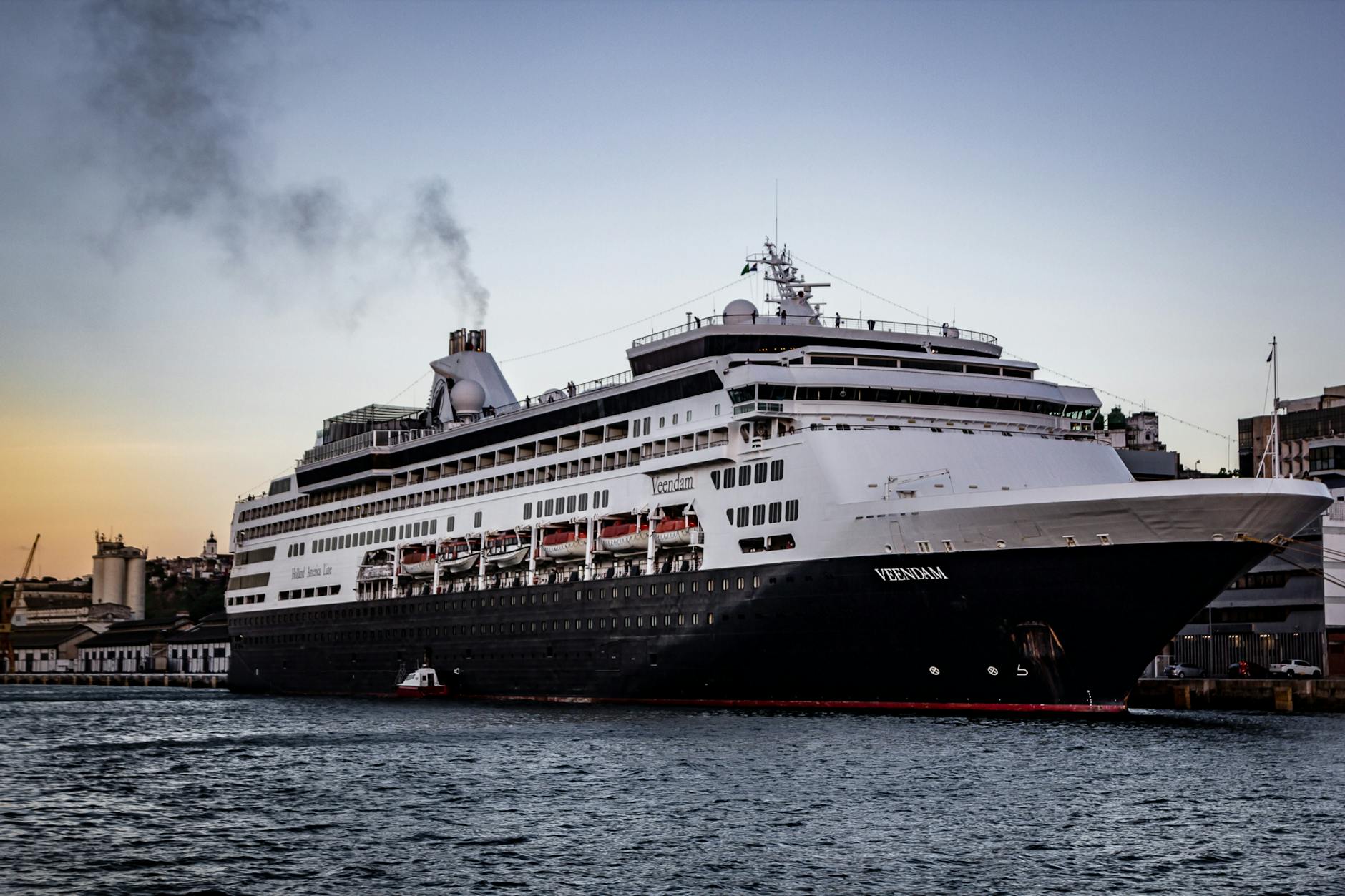 Cruise ship docked at a harbor for Brisbane port-call timing decisions.