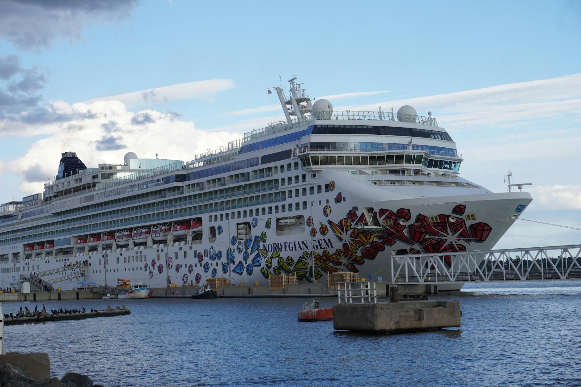 Large cruise ship docked at a port for Brisbane transfer planning.