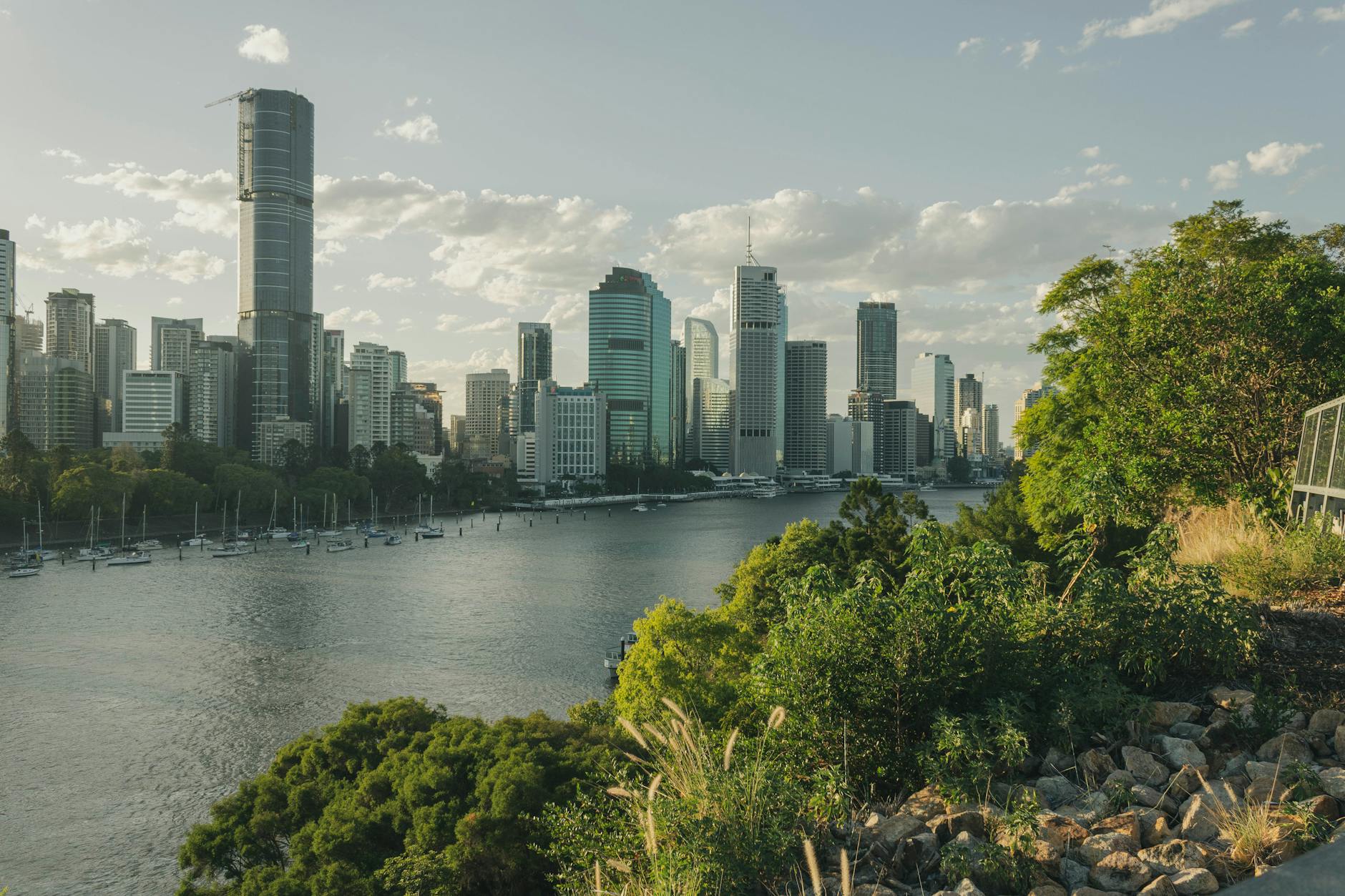 Brisbane skyline and greenery for weather-aware first-day planning.