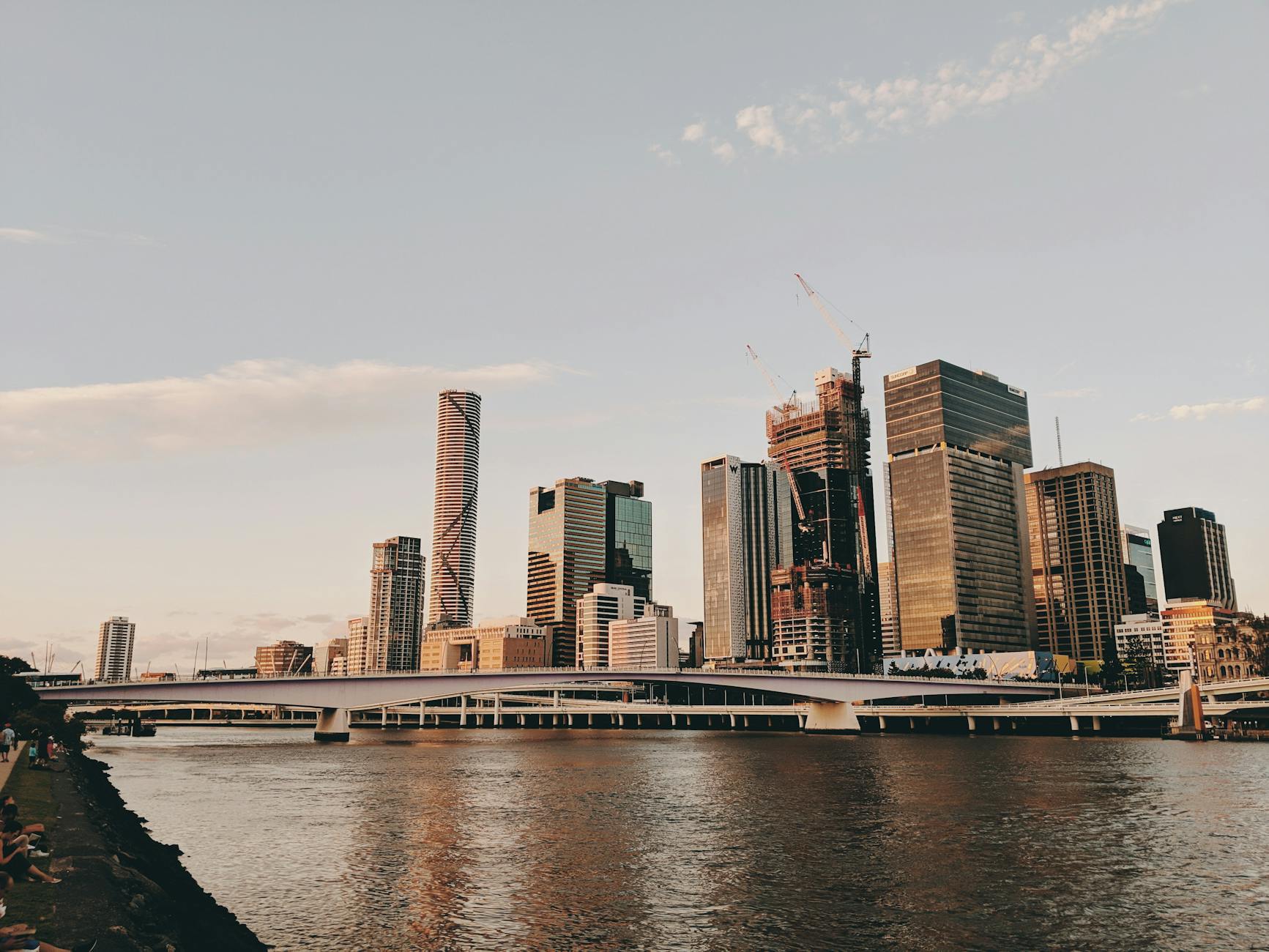 Brisbane skyline at sunset for first hotel choice planning.
