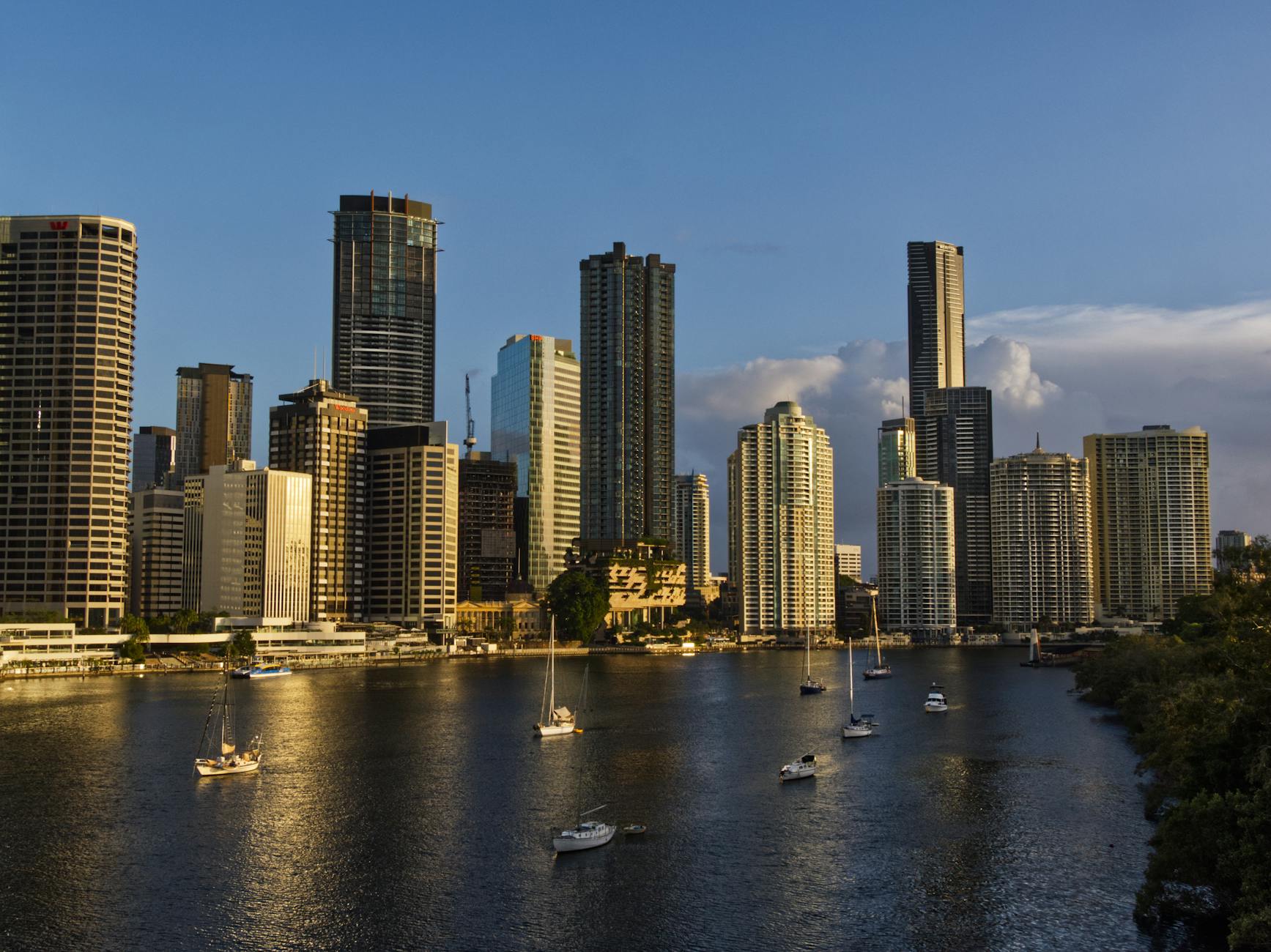 Brisbane skyline reflected in the river for first-time travel report planning.