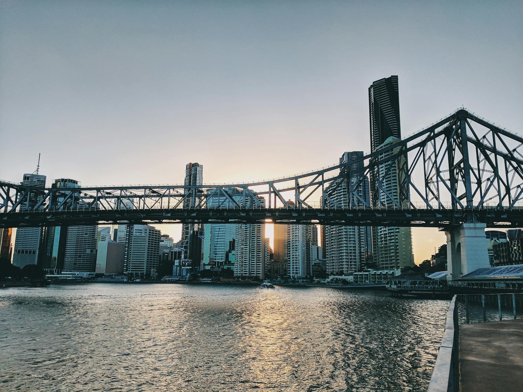 Brisbane skyline and Story Bridge at dusk for luxury river planning.