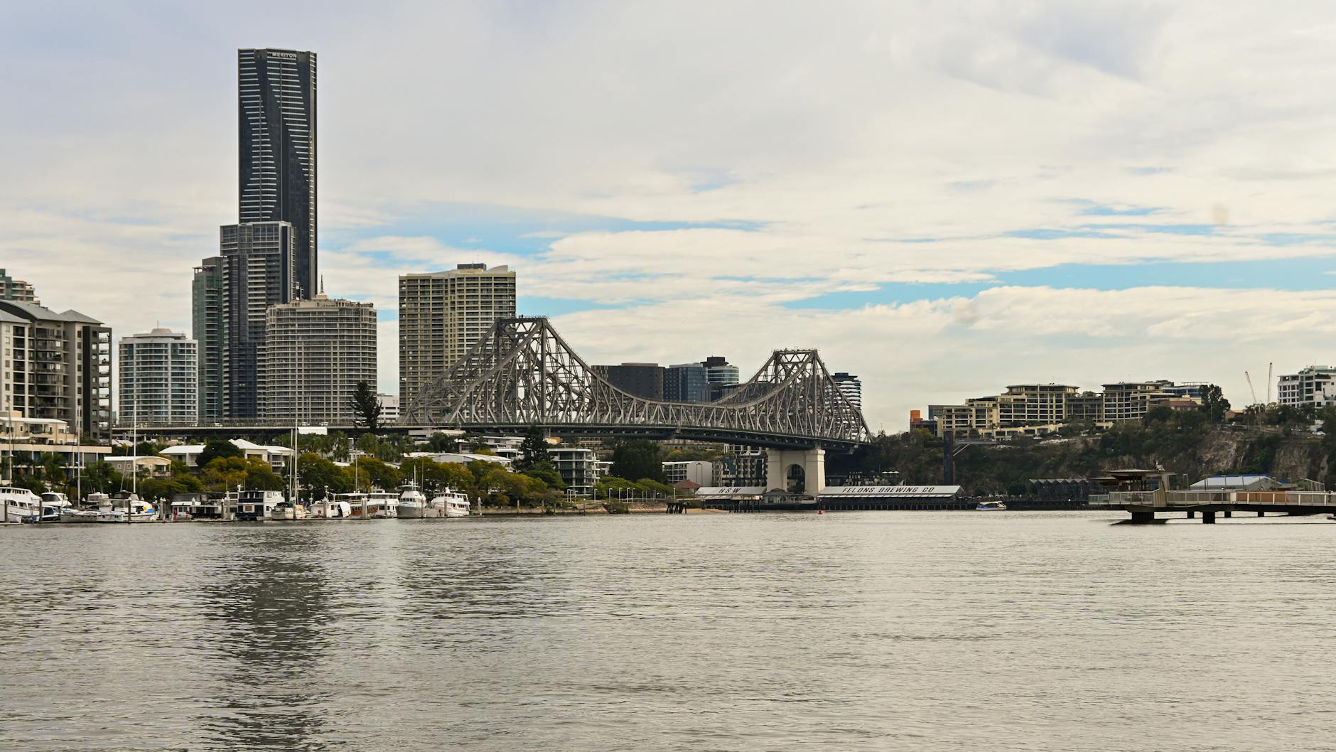 Brisbane skyline and Story Bridge for weather-aware luxury planning.