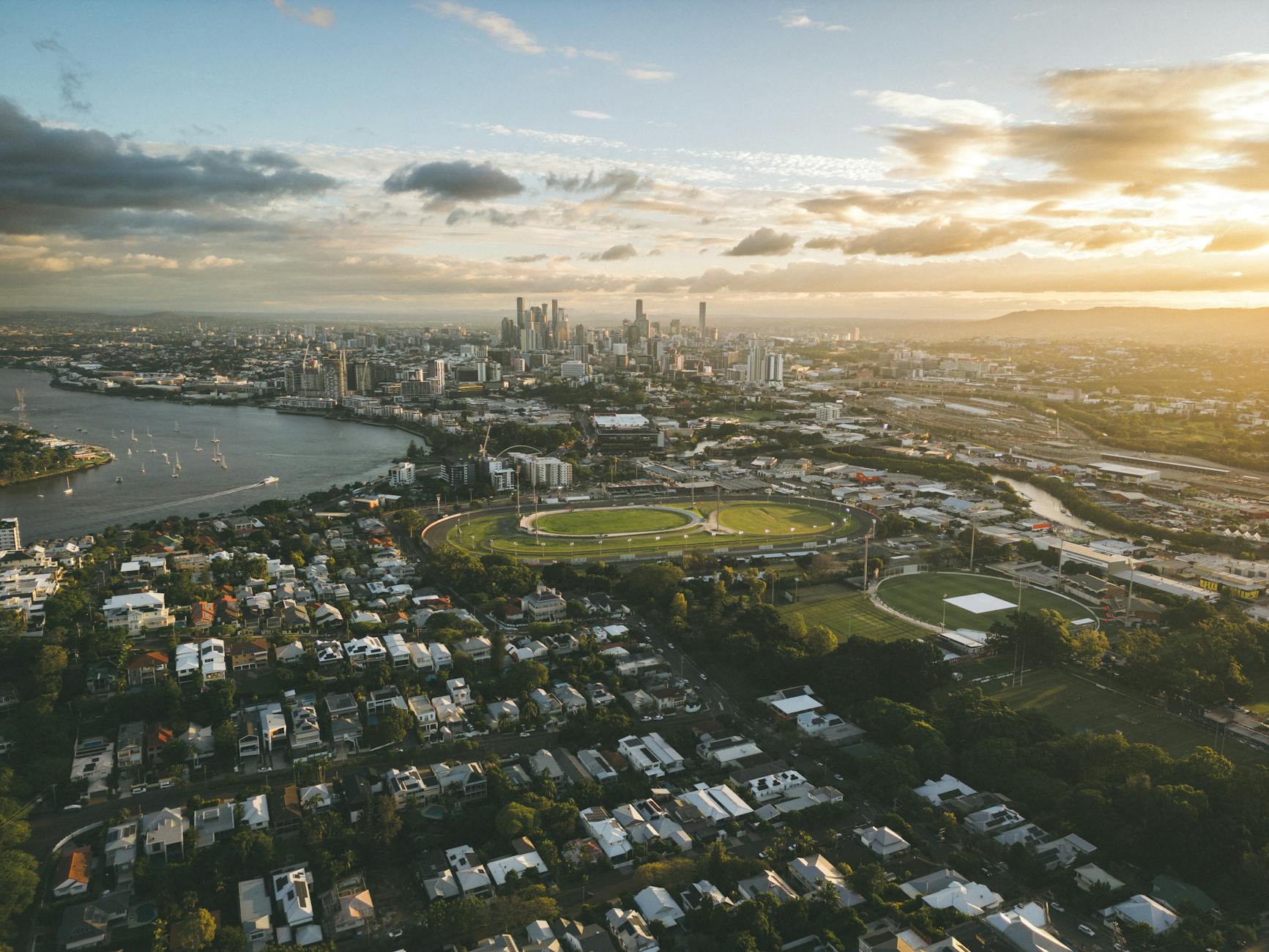Aerial Brisbane river and skyline for luxury route planning.