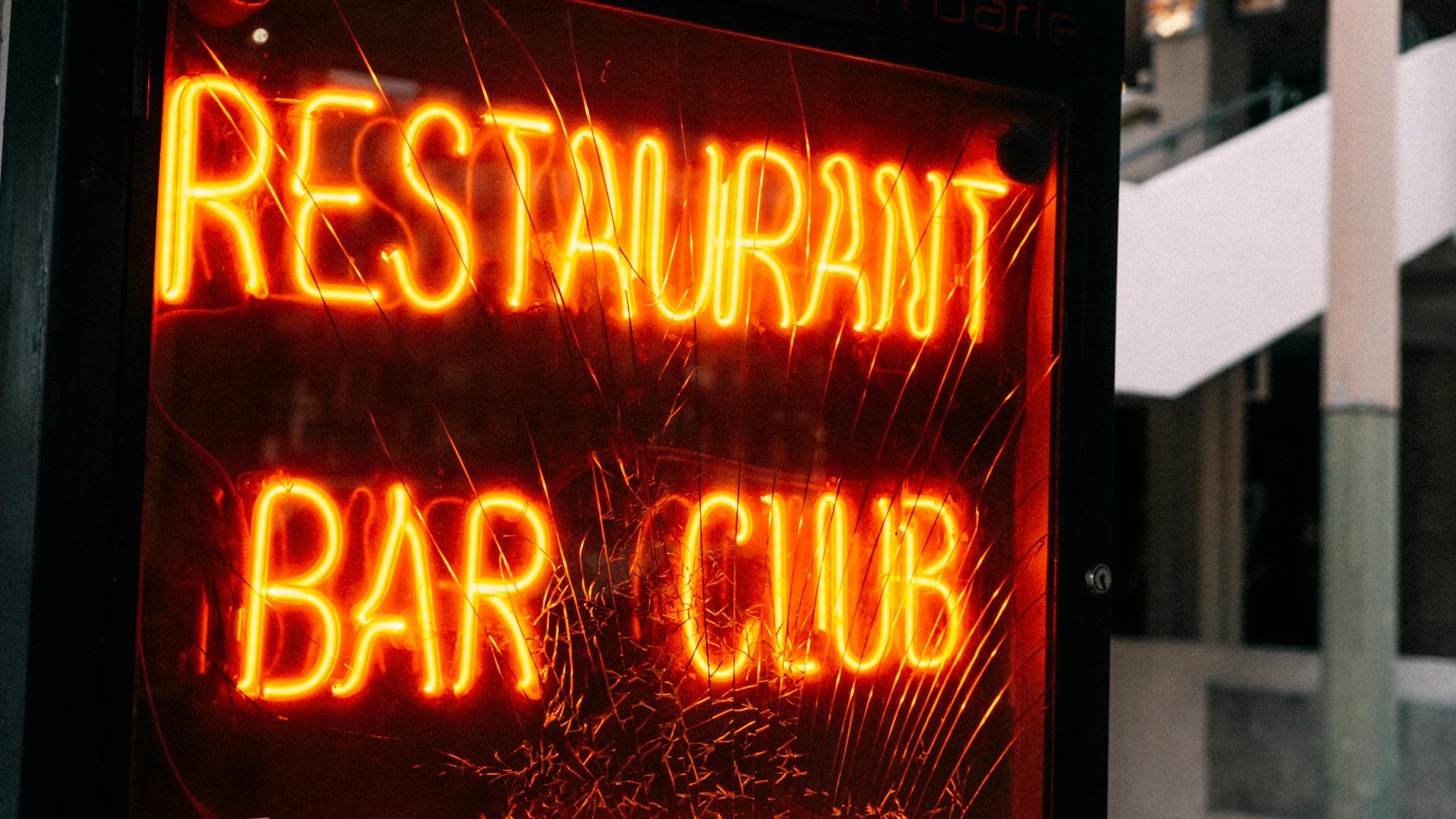 Neon restaurant bar club sign for Brisbane nightlife safety planning.