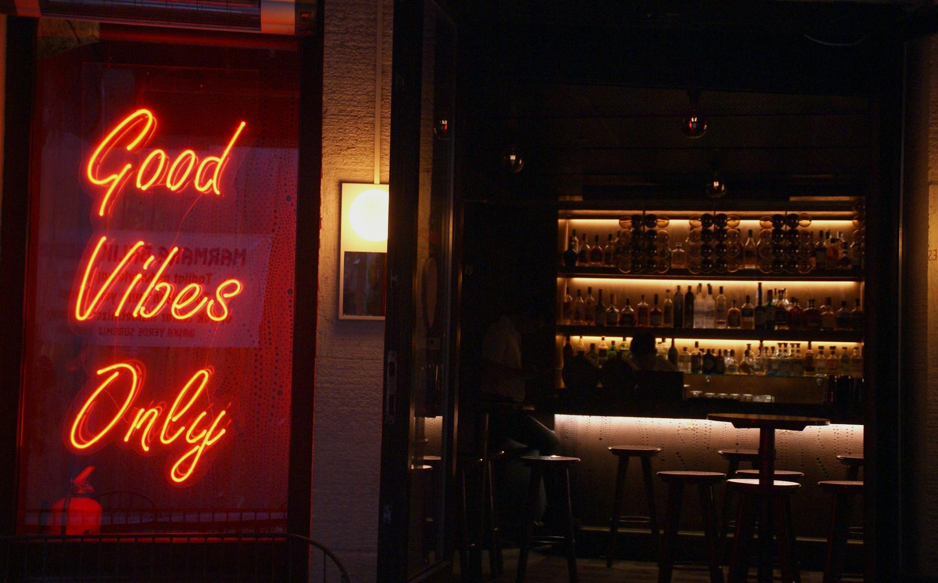Neon bar entrance for Brisbane nightlife recovery planning.