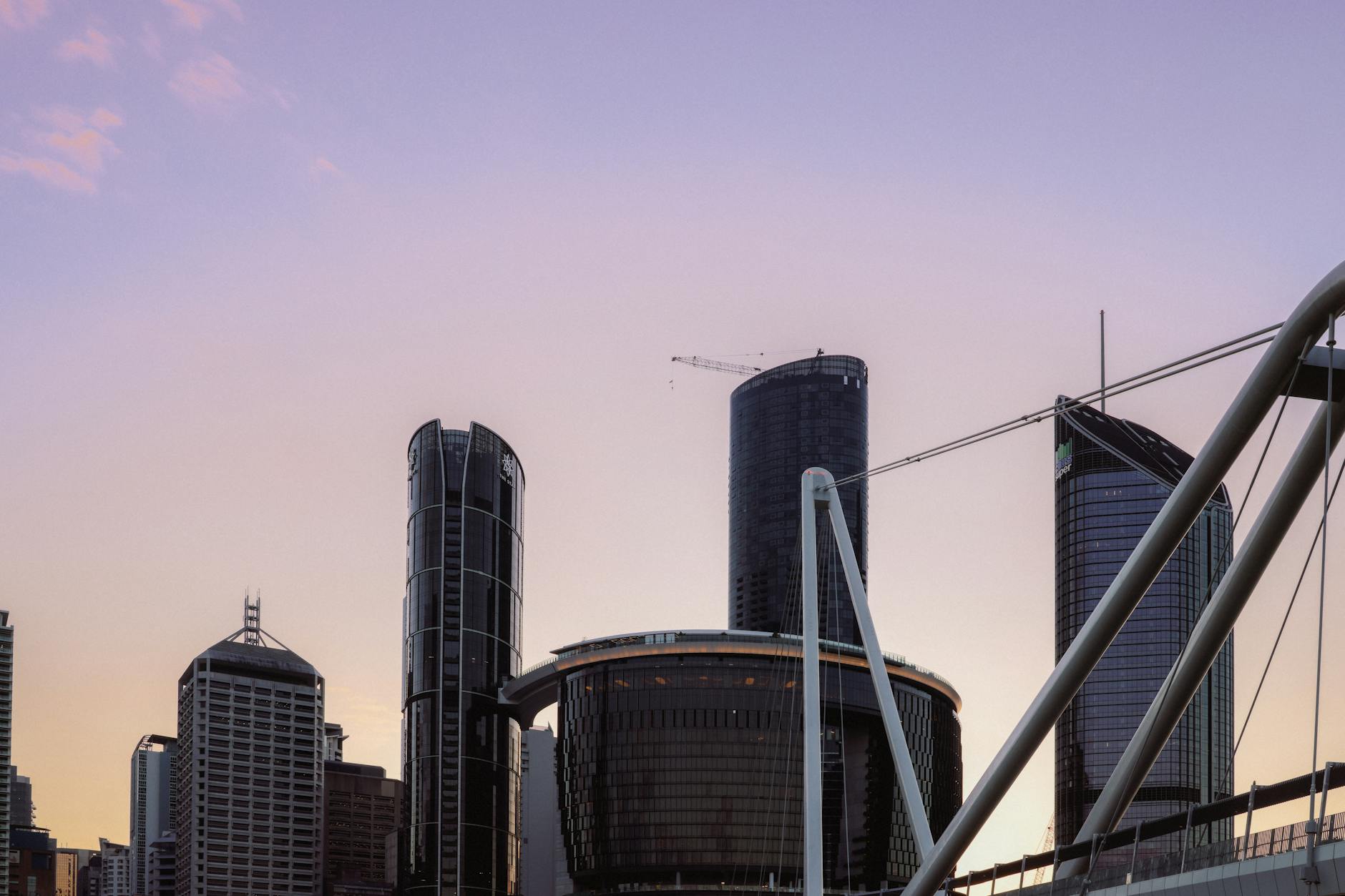 Brisbane skyline at sunset for heat and walking exposure planning.