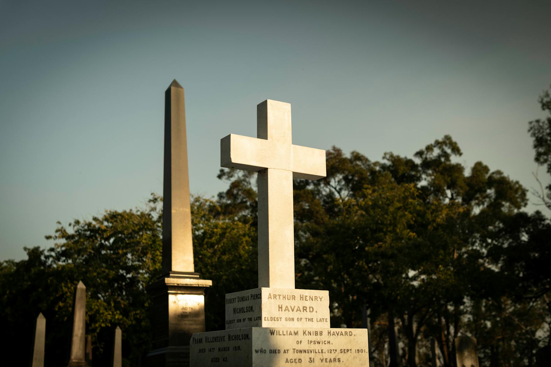 Historic crosses at sunset in Toowong Cemetery for Brisbane lodging decisions.