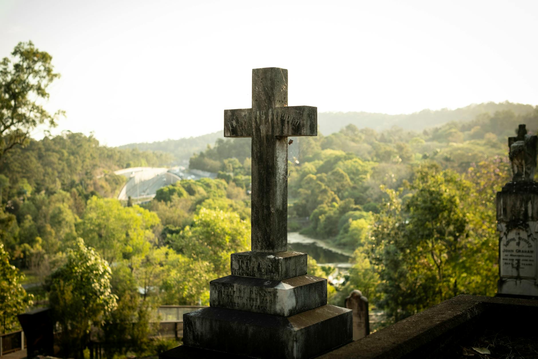 Weathered cross at Toowong Cemetery in Queensland for Brisbane pilgrimage planning.