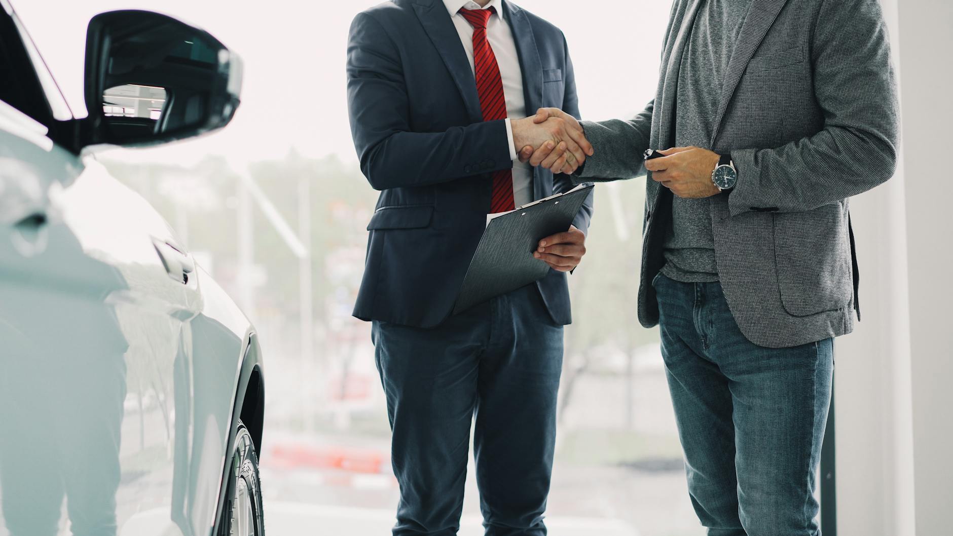 Handshake after a customer meeting for Brisbane sales route planning.
